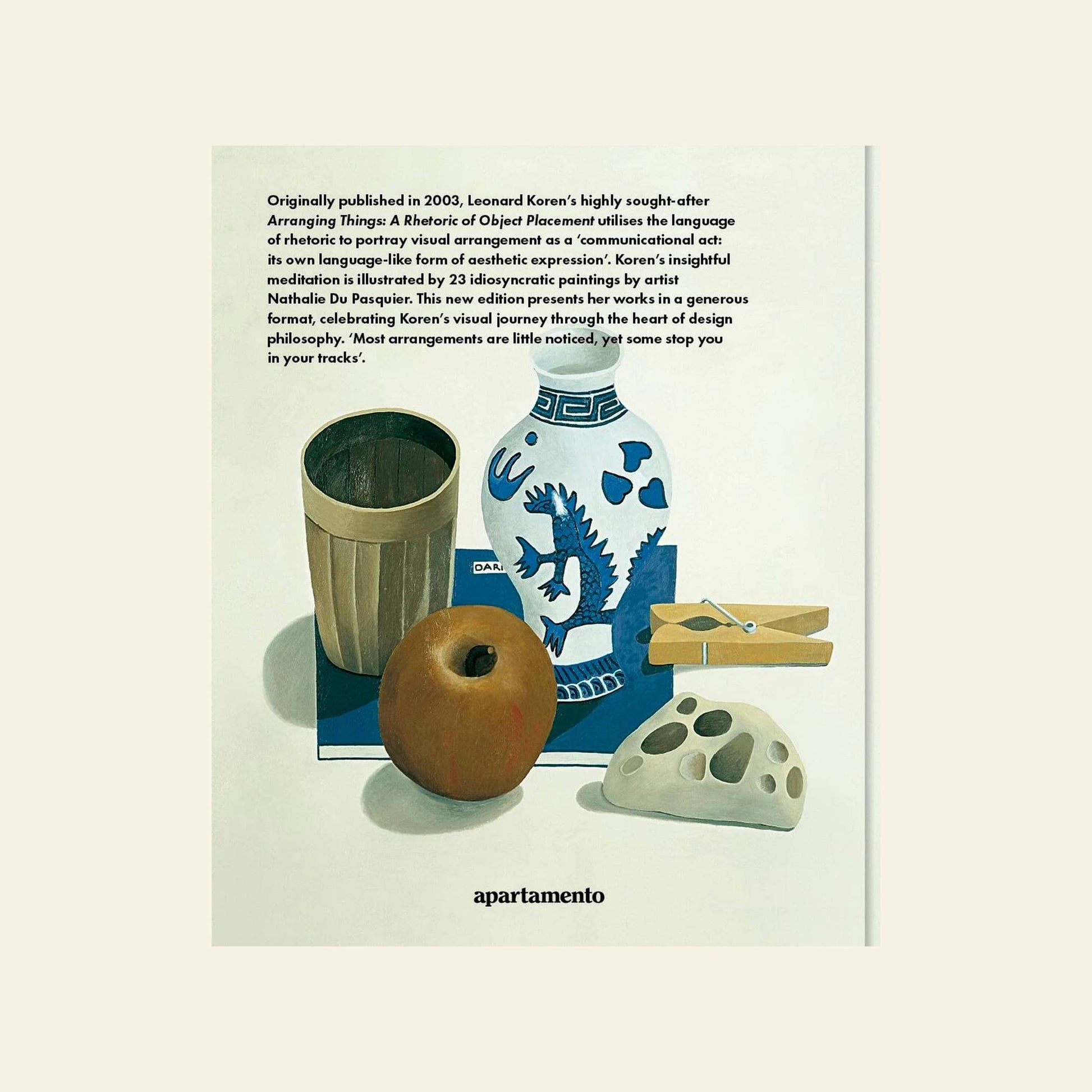 Apartamento Arranging Things: A Rhetoric of Object Placement by Apartamento features a still life painting with a ceramic vase, wooden cup, clothespin, white stone, apple, and blue card—all thoughtfully arranged below a descriptive paragraph.