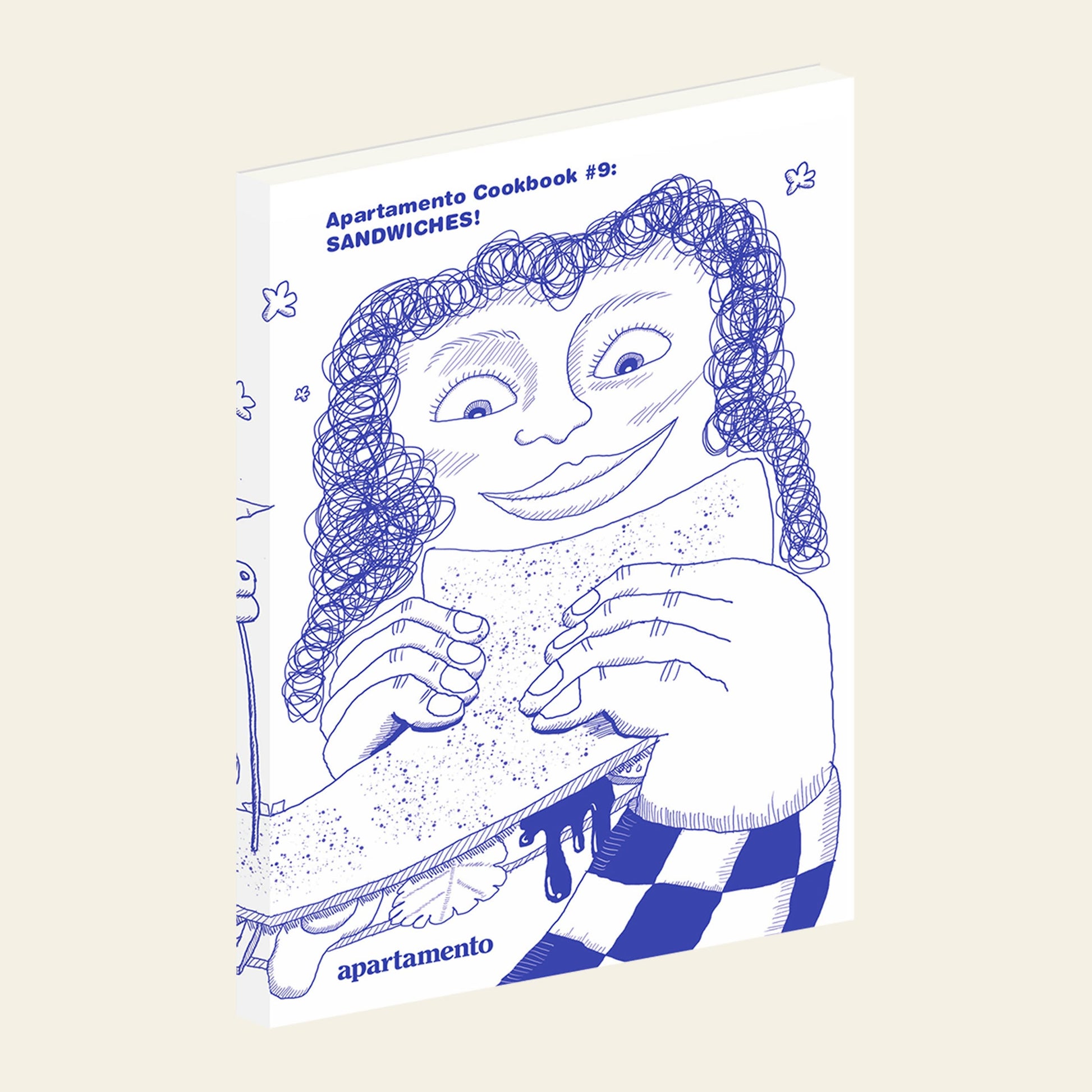 The cover of Apartamento Cookbook #9: Sandwiches! by Apartamento shows a blue line drawing of a smiling, curly-haired person holding a big sandwich with playful patterns—ideal for fans of sandwich recipes.