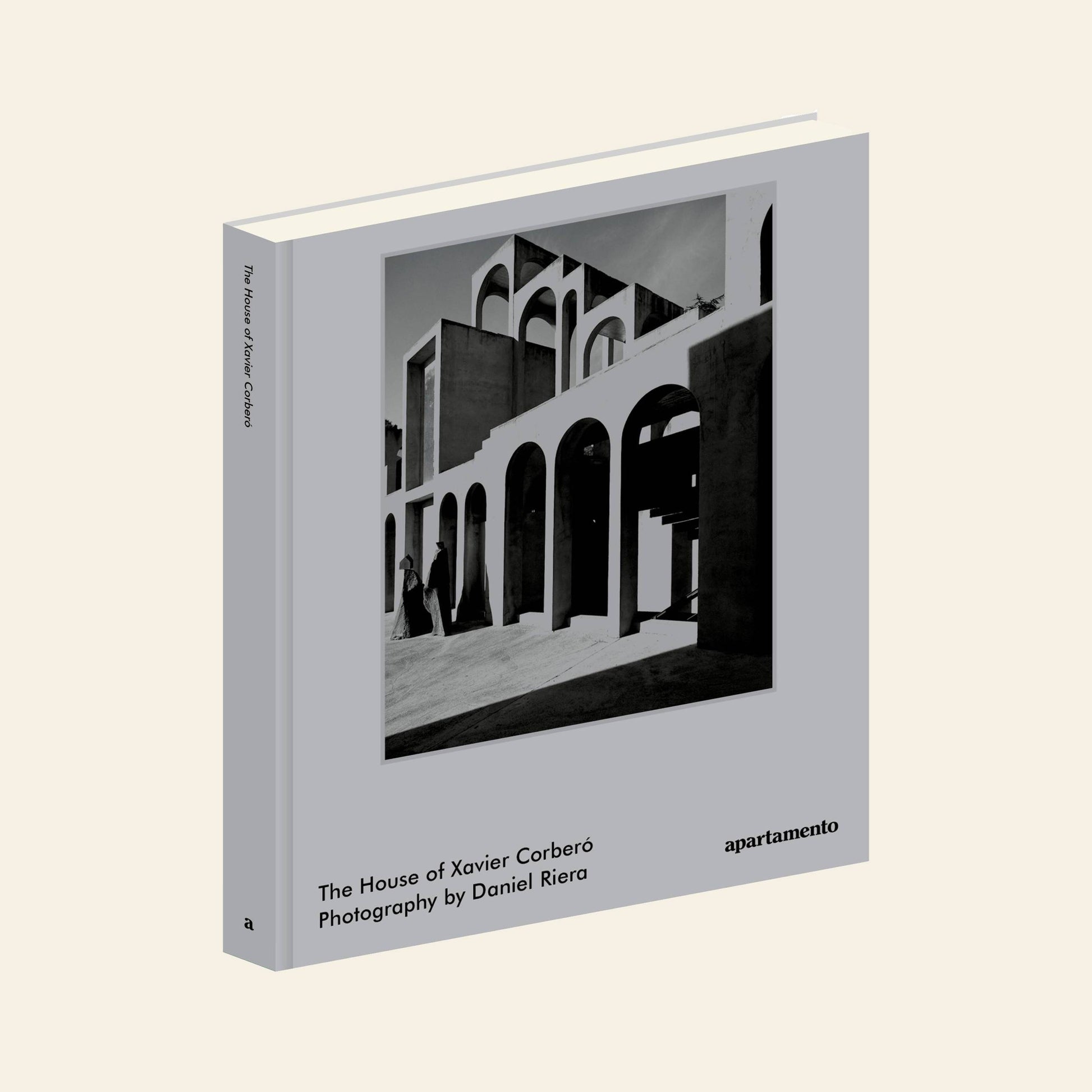 Apartamento The House of Xavier Corberó is a gray hardcover book featuring Daniel Riera’s black and white photo of architectural arches from Corberó’s Esplugues de Llobregat home. Published by Apartamento.