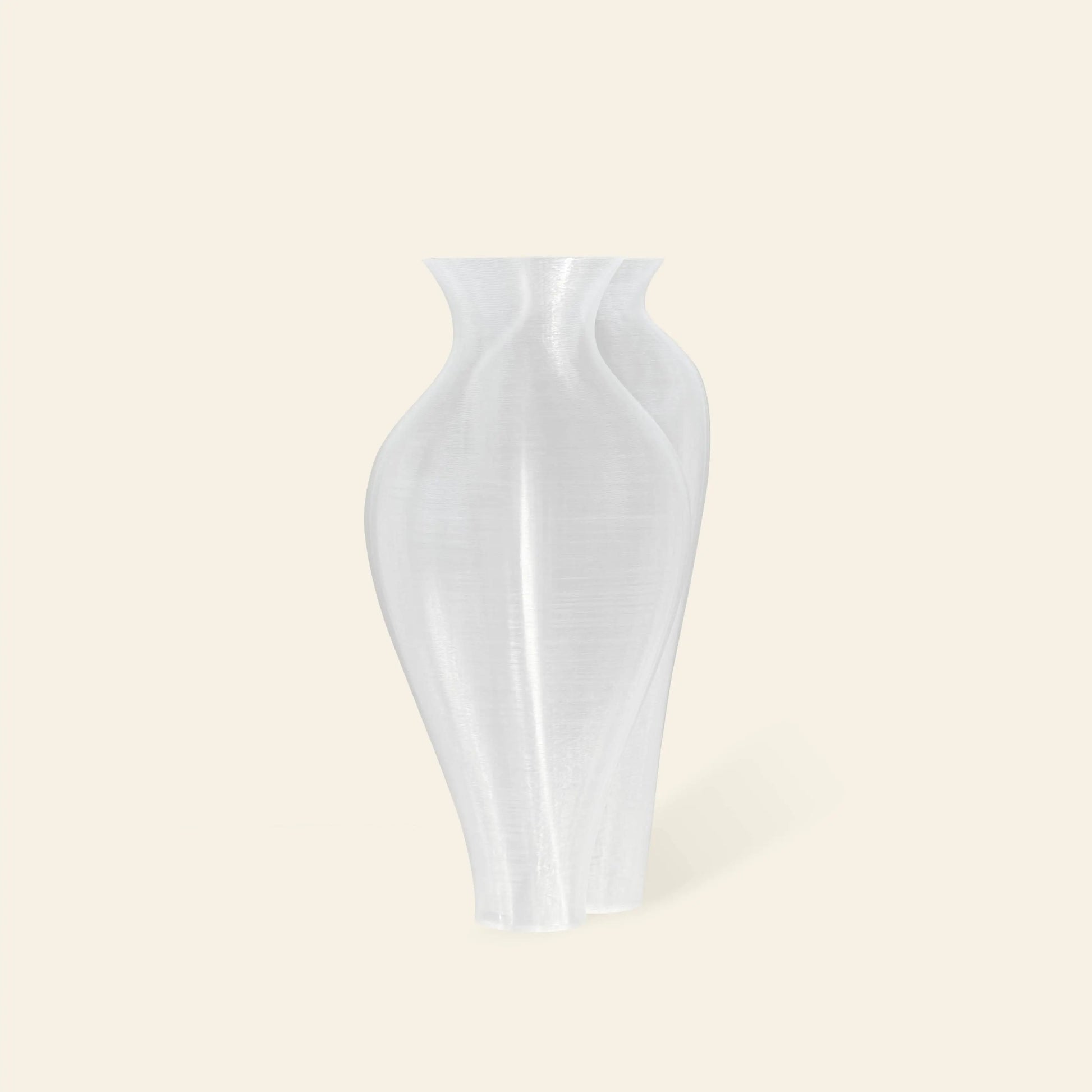 The Argot Studio Soeurs Vase by Argot Studio features a translucent white finish, smooth curves, and a modern hourglass design, displayed against a plain light beige background.