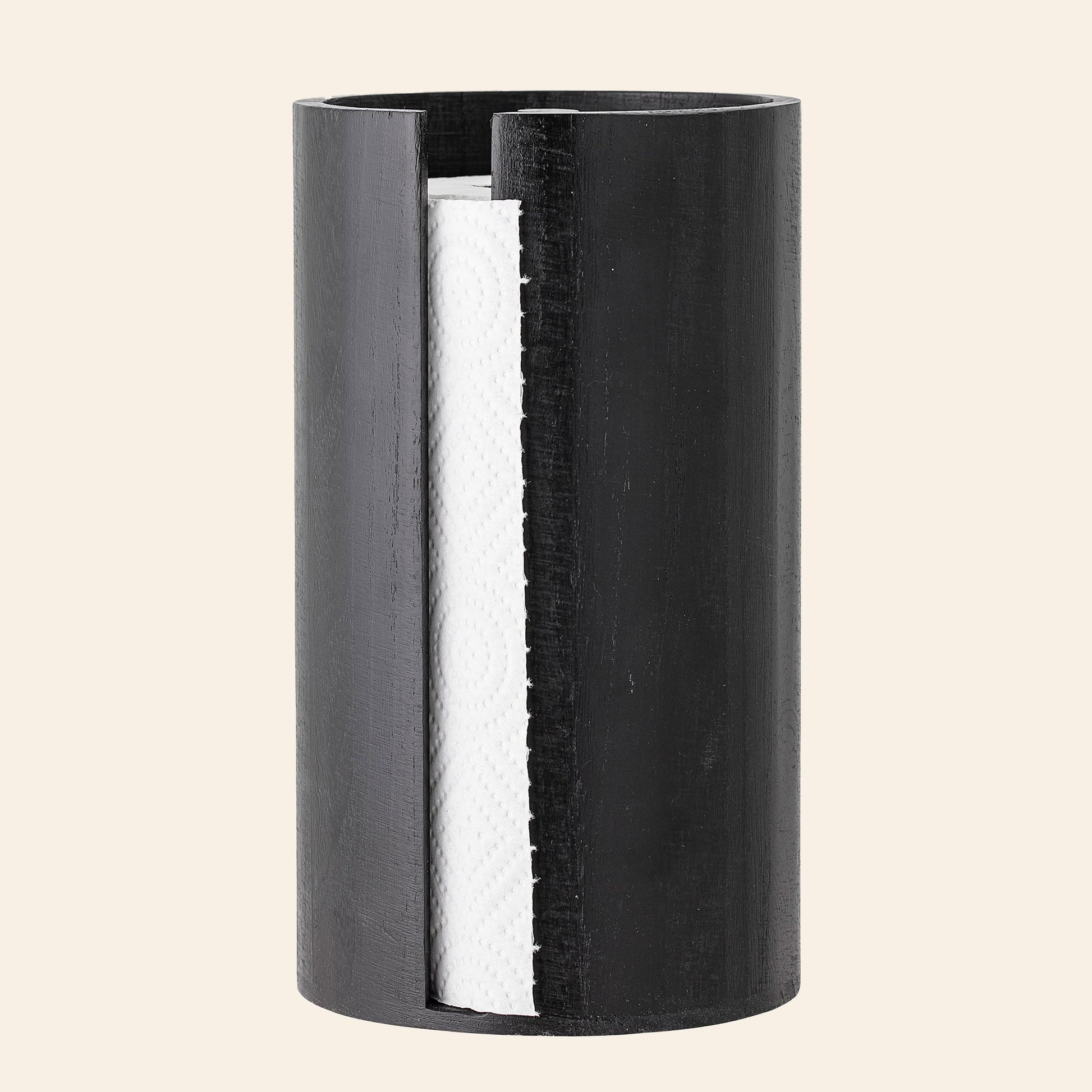 The Bloomingville Celian Kitchen Paper Stand, in a sleek black cylindrical design with an open side, elegantly displays a white paper towel roll—bringing Scandinavian style to your kitchen.