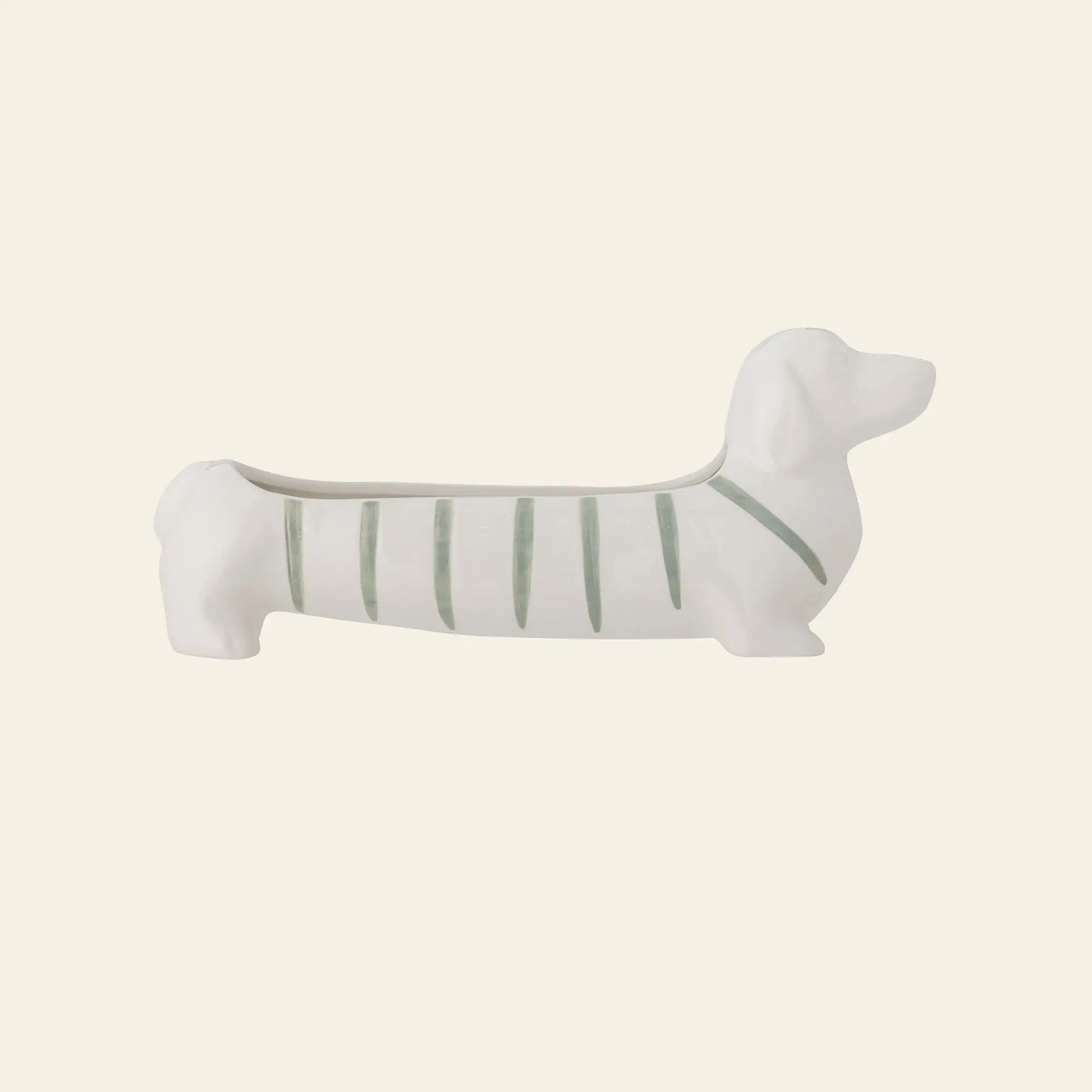 The Bloomingville Djaco Bowl by Bloomingville is a whimsical ceramic planter shaped like a dachshund dog, featuring white and light green stripes—perfect for decorative storage.