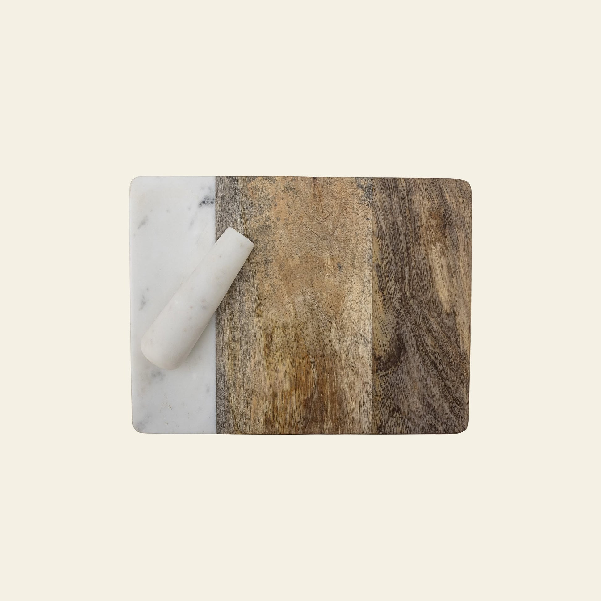 The Bloomingville Havannah Cutting Board w/Pestle by Bloomingville features three sections—white marble, mango wood, and dark wood—with a white marble pestle resting diagonally on the marble section against a light background.