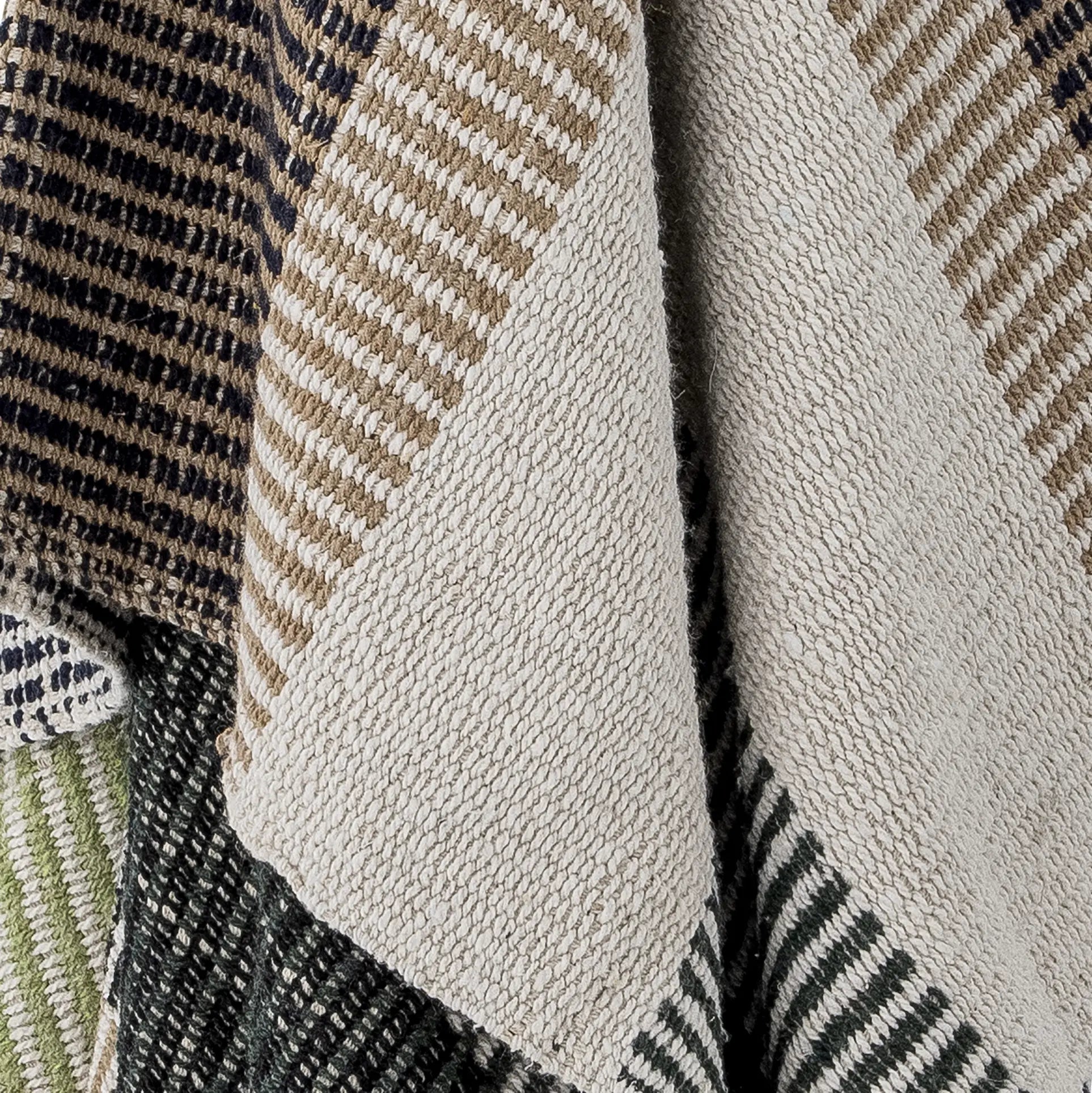 A close-up of the Bloomingville Isnel Throw from Bloomingville, showing its textured, woven recycled cotton in charming beige, tan, dark blue, and green stripes with visible weave and detailed threads in overlapping layers.