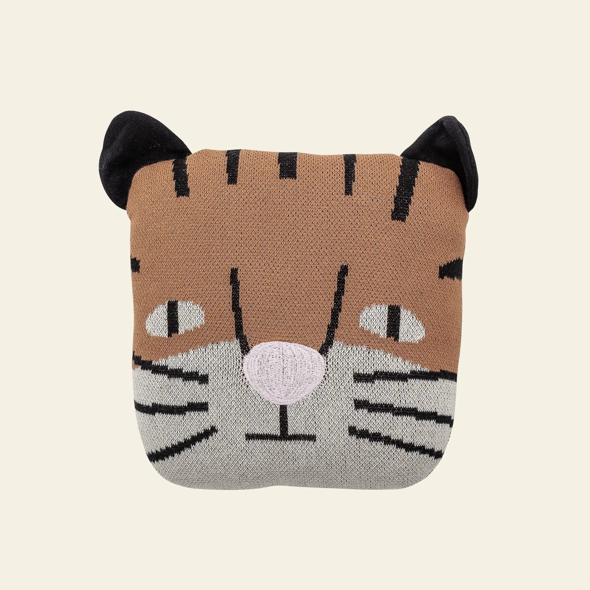 The Bloomingville Muzamel Cushion is a square, knitted soft toy cushion by Bloomingville, featuring a tiger face with black embroidered stripes, pointed ears, a pink nose, and whiskers—a delightful decorative accent for any room.
