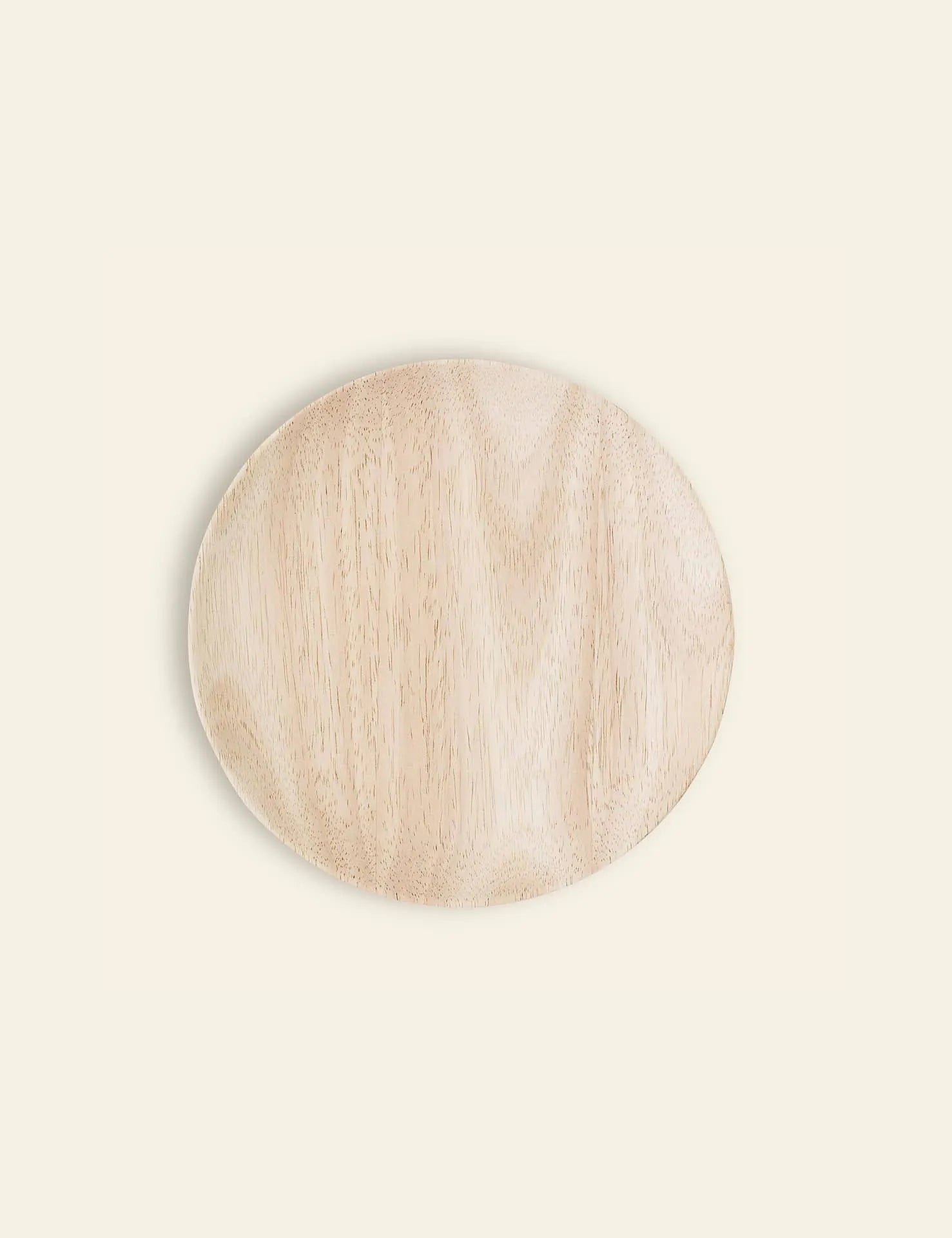 The Bloomingville Nolia Plate, 20cm—a round, light-toned plate with a smooth surface and subtle rustic finish—is shown from above on a plain off-white background.