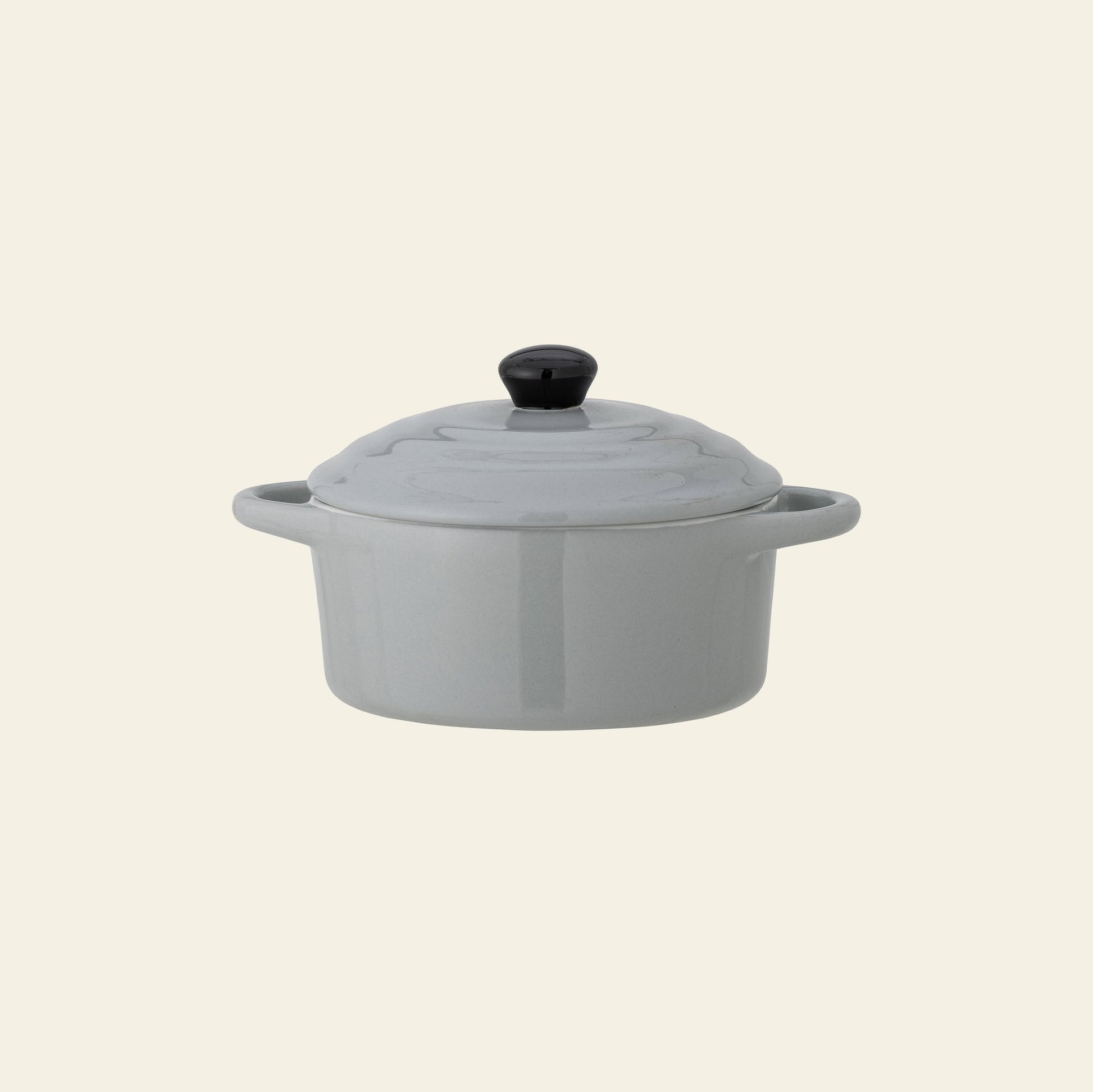 The Bloomingville Thanos Oven Dish w/Lid by Bloomingville is a small, light gray stoneware casserole dish with two side handles, ideal for serving casseroles. Photographed on a plain off-white background.