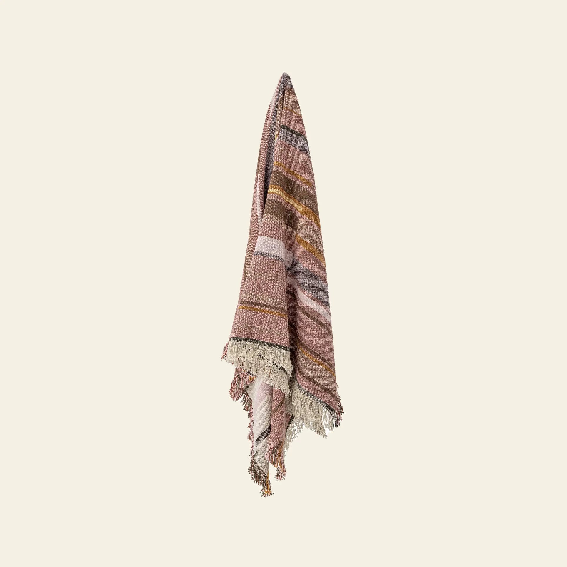The Bloomingville Toscana Throw by Bloomingville, crafted from recycled cotton, showcases a bold graphic stripe pattern in brown, pink, and beige with decorative fringed edges, displayed against a plain light background.