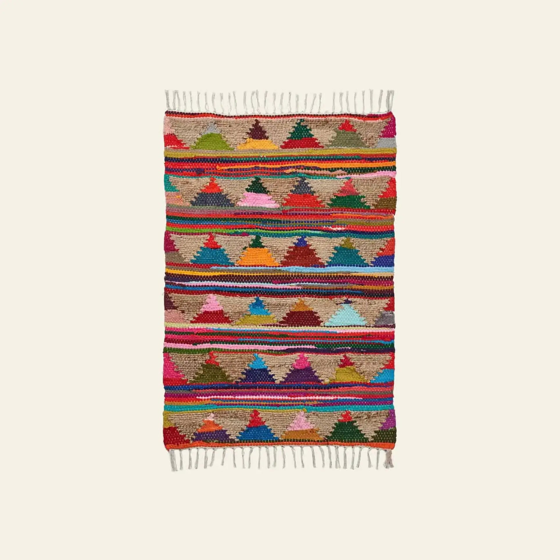 The Bongusta Pyramid Chindi Rug (60x90) features red, green, blue, yellow, pink, and brown geometric patterns in cotton with rows of triangles, horizontal stripes, and fringed edges on both ends.