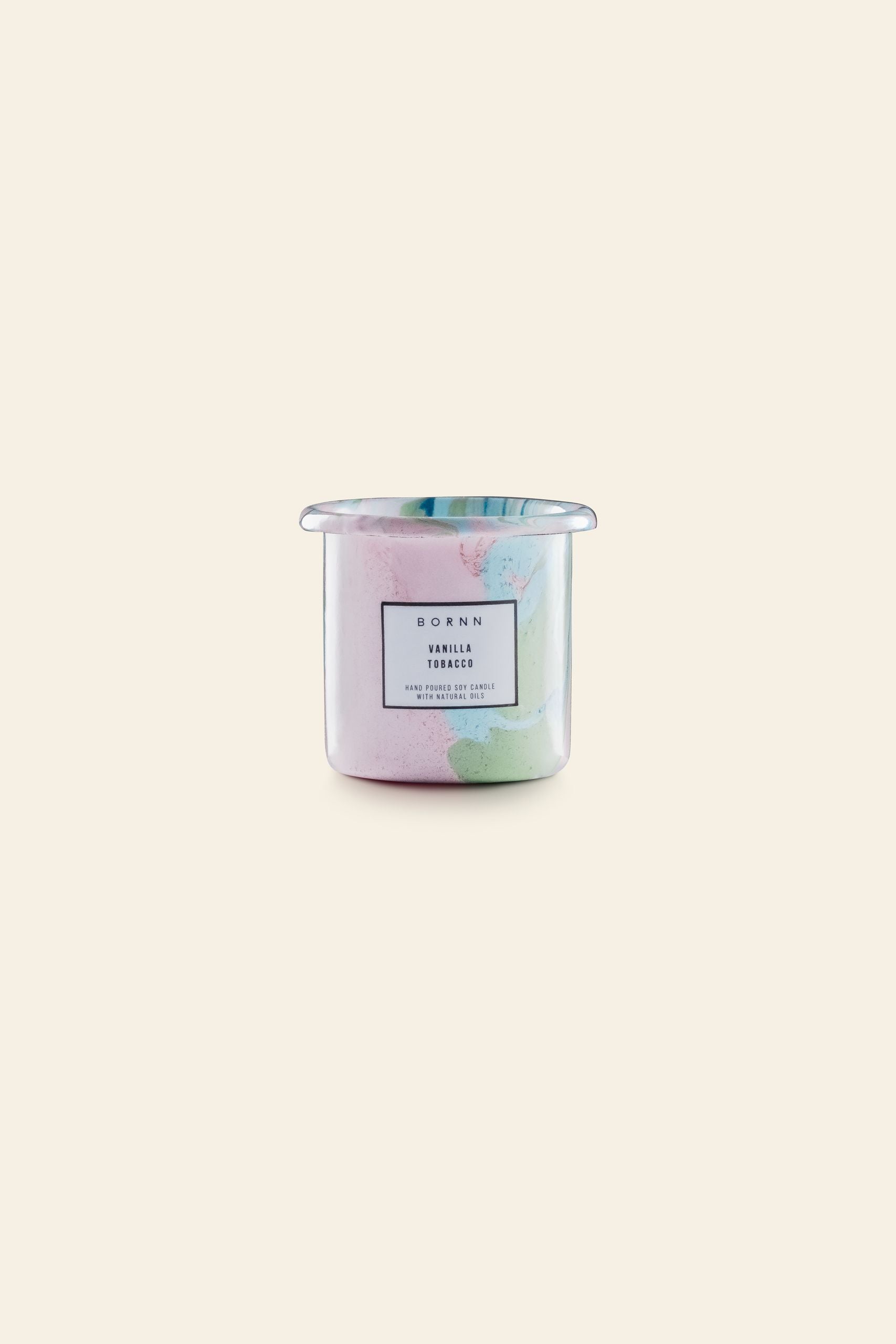 The Bornn Enamelware Candle Tobacco-Vanilla by Bornn Enamelware features a pastel marbled enamel design and is set against a beige background—ideal for adding a relaxing touch to any space.