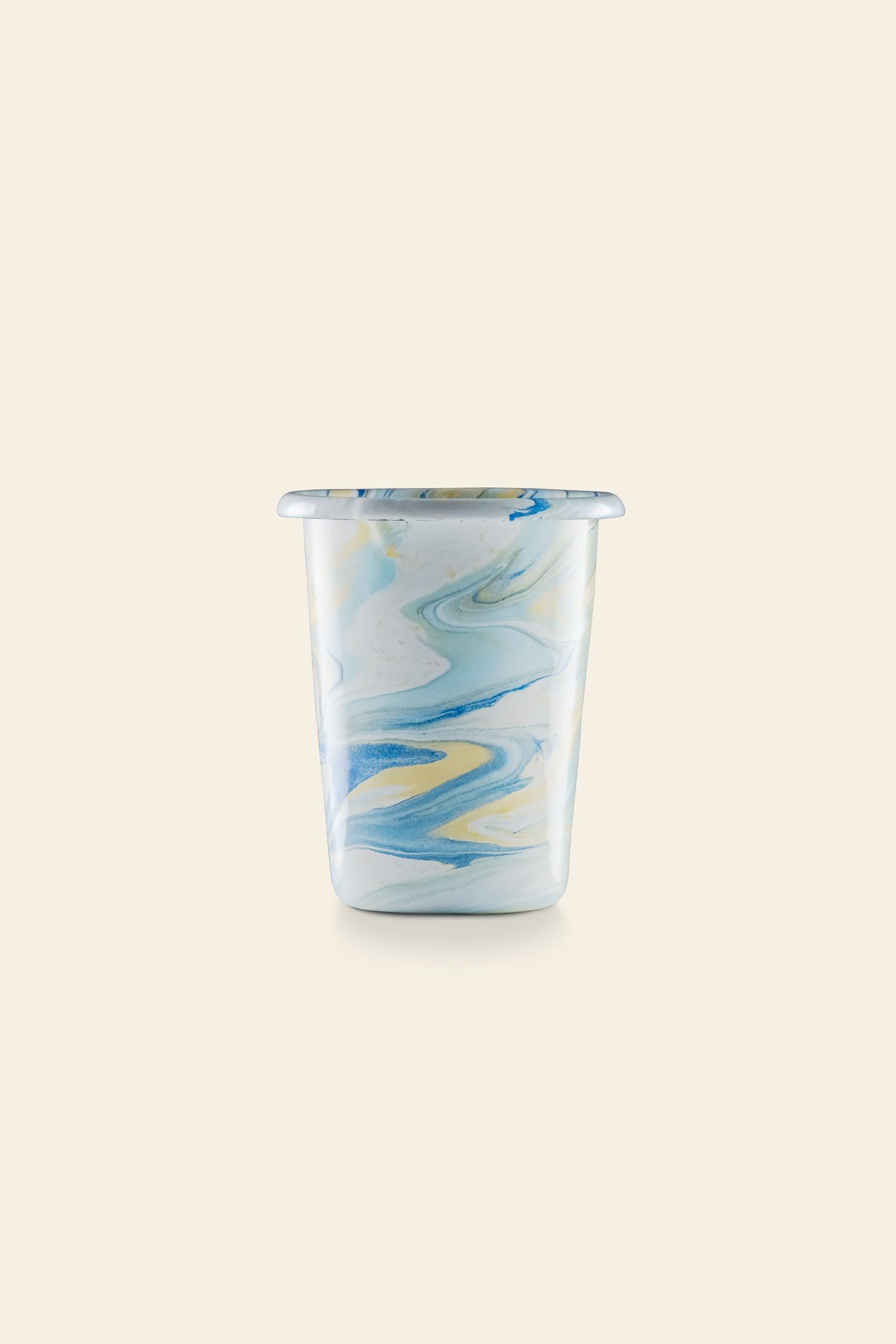 The Bornn Enamelware New Marble Tumbler Cup features a blue, yellow, and white marbled pattern on light beige. Available at The Stacked Store.