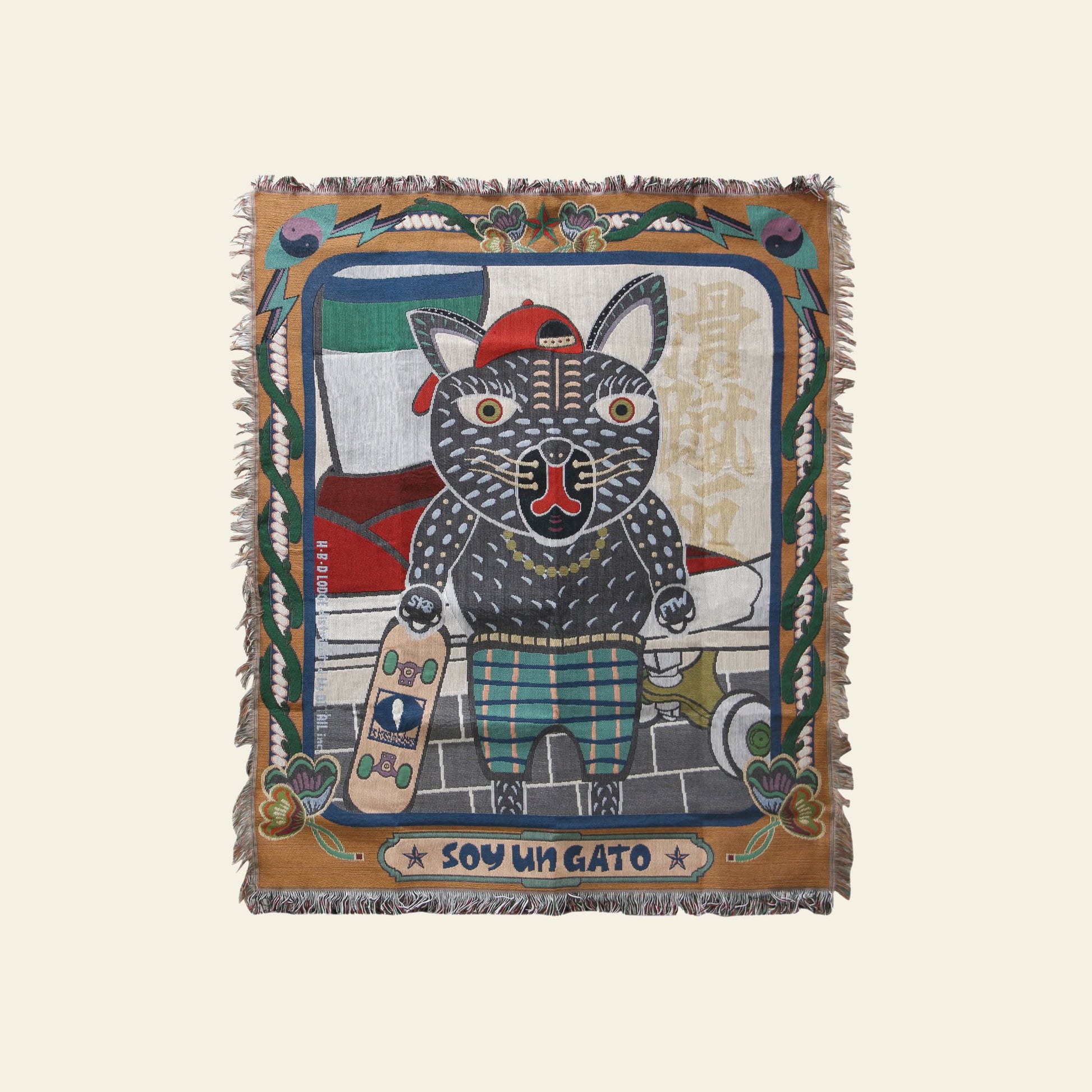 The DETAIL Black Cat Oax Throwket by DETAIL showcases a cartoon black cat in a red hat and plaid pants with a skateboard, car, and plants. SOY UN GATO adds playful flair to this multicolour throw blanket.