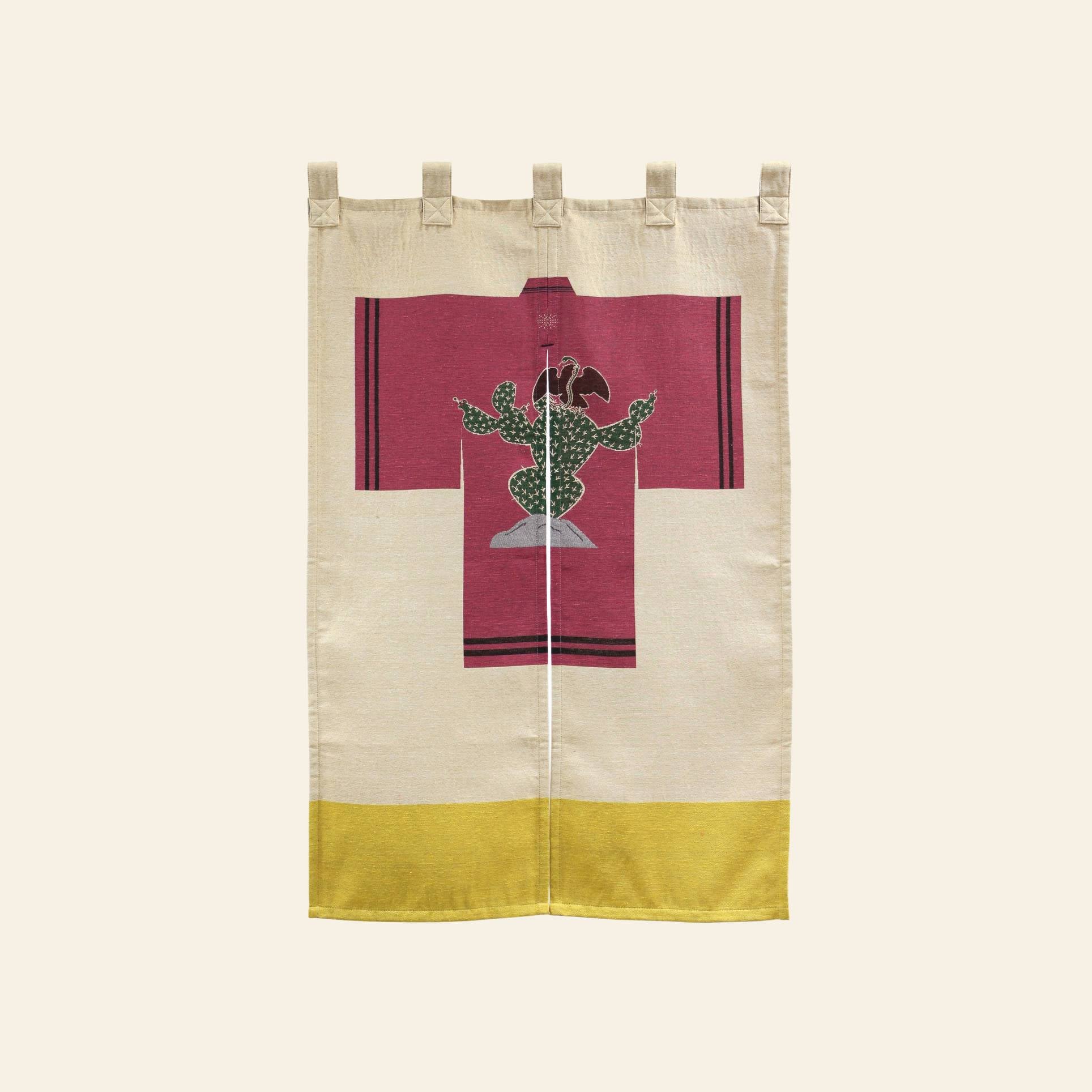 The DETAIL Noren Curtain by DETAIL is a beige fabric wall hanging with a yellow stripe and a central maroon tunic featuring a cactus with an eagle, inspired by the Mexican flag emblem’s plant design.