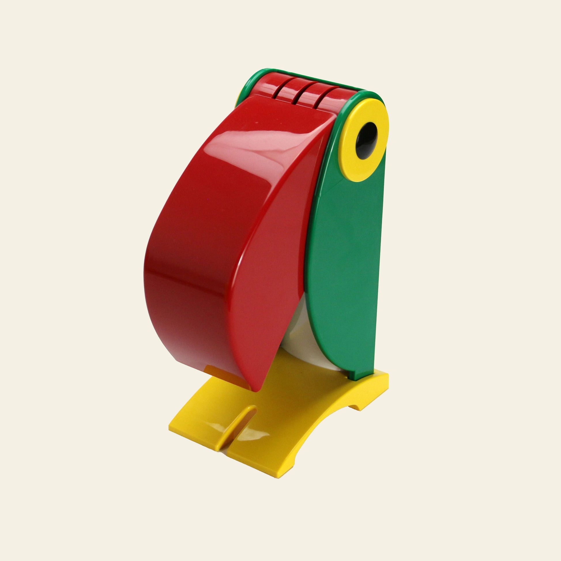 The DETAIL Toucan Lamp by DETAIL features a playful, vintage-inspired toucan design with a red beak, green head, yellow eye, and yellow feet, standing upright and adding colorful charm to any light background.