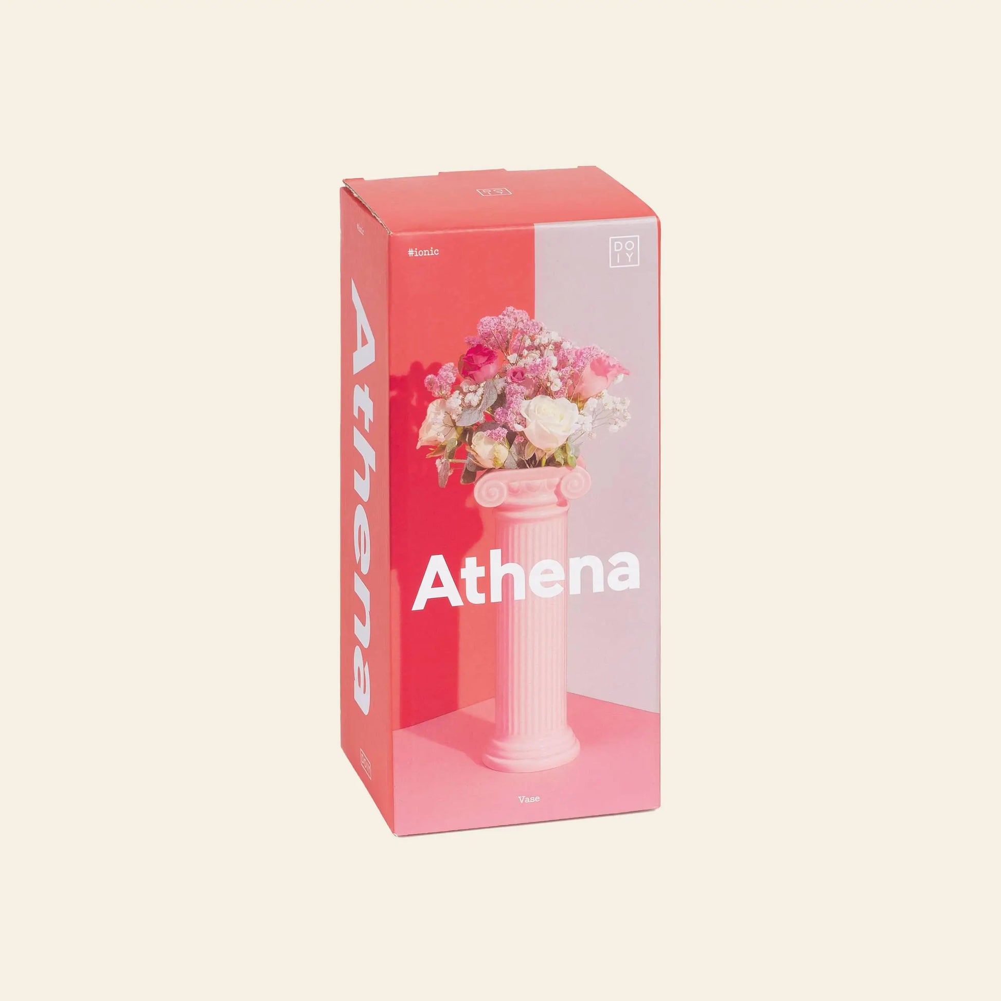 A pink rectangular box labeled DOIY features the DOIY Athena Vase, inspired by a Greek Ionic column, elegantly holding assorted pink and white flowers against a soft beige background.