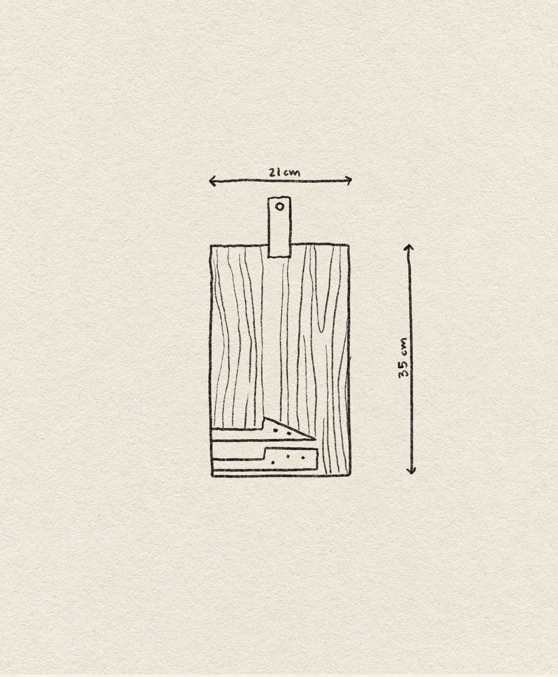 The DOIY Cheeseporn by DOIY is a simple Acacia wood cutting board with a handle, measuring 21x35 cm—perfect as a cheeseboard—shown on a textured beige background.