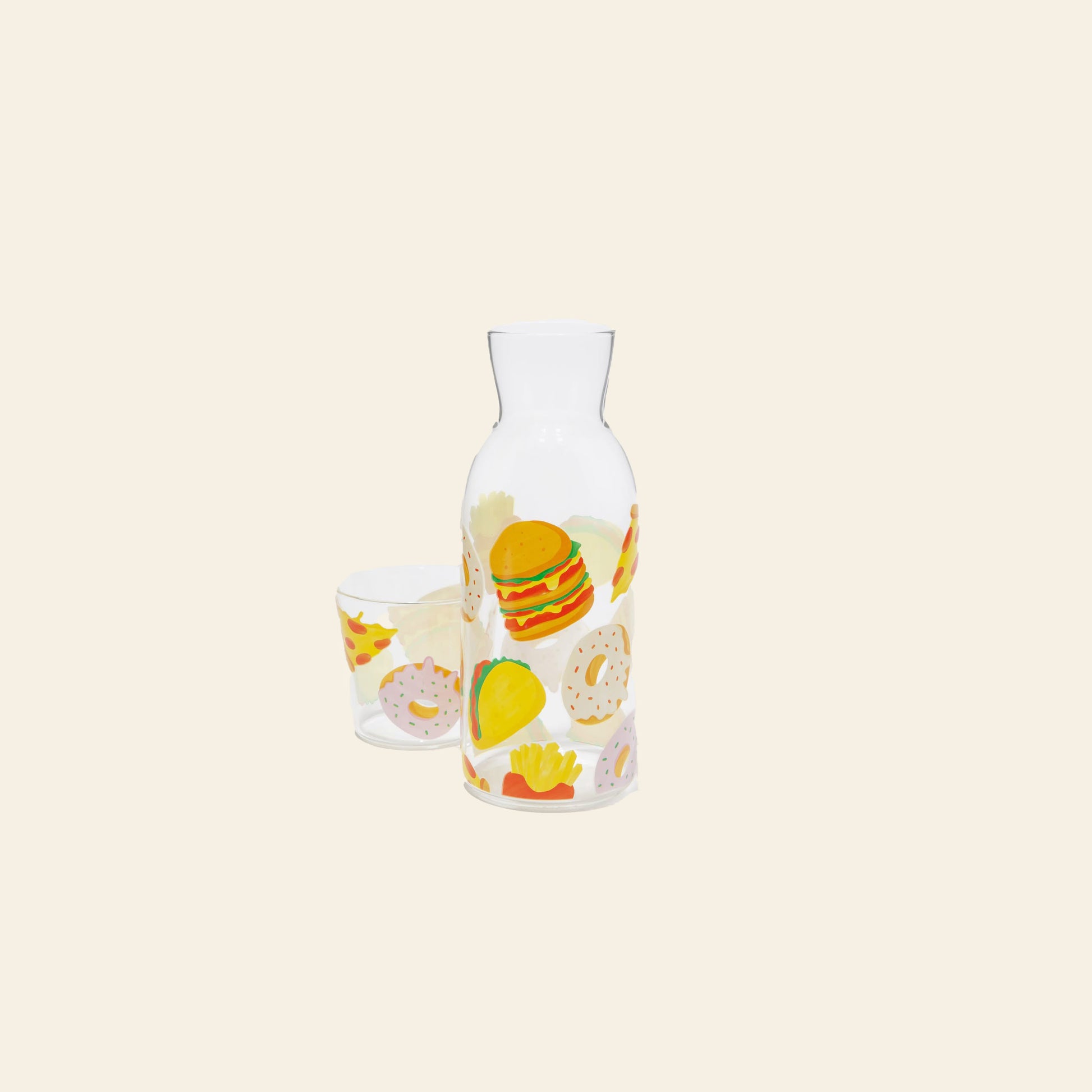 The DOIY Fast Food Jar & Glass Set features clear glassware adorned with vibrant fast-food icons, channeling the playful 1950s diner vibe. From brand DOIY, this set is shown on a simple cream background.
