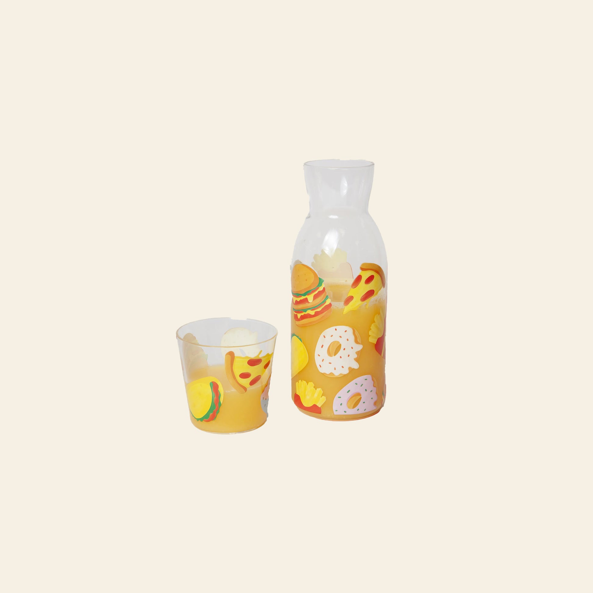 The DOIY Fast Food Jar & Glass Set by DOIY features a clear pitcher and tumbler decorated with colorful burgers, fries, pizza, and pretzels—bringing playful 1950s diner nostalgia to your table.