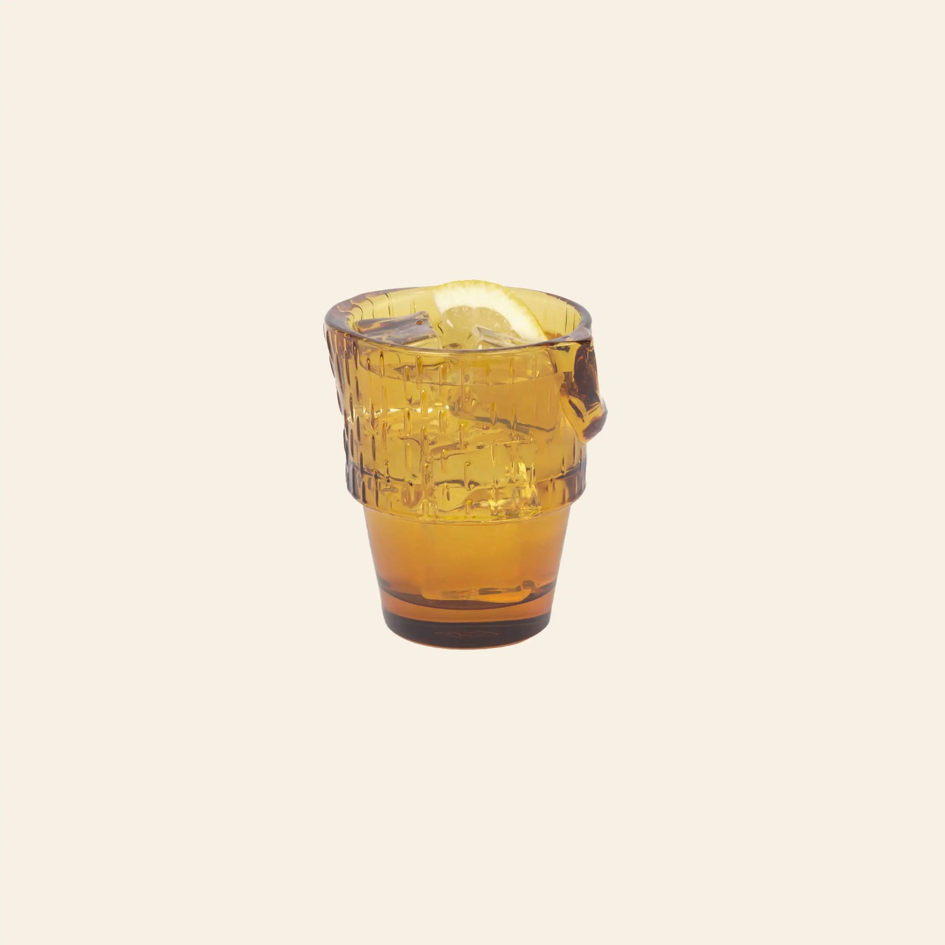 A DOIY Kitty Glasses, Set of 4 tumbler from DOIY’s collection, filled with an orange drink and lemon wedge, is displayed against a plain light background.