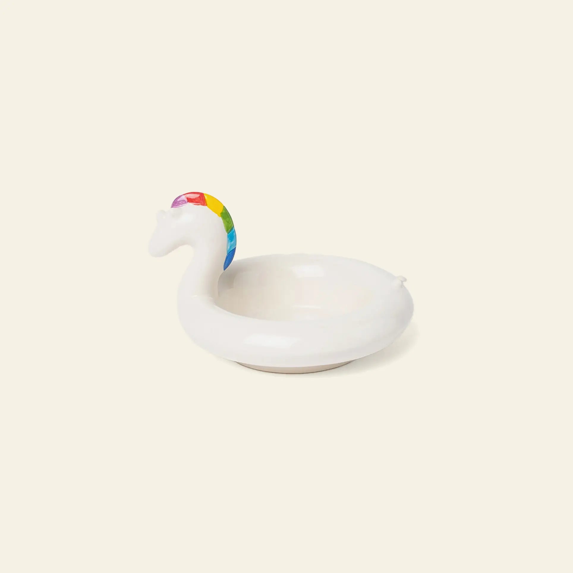 The DOIY Unicorn Floatie Bowl by DOIY is a small white ceramic bowl shaped like a unicorn with a rainbow mane—an adorable decorative accent for any space.
