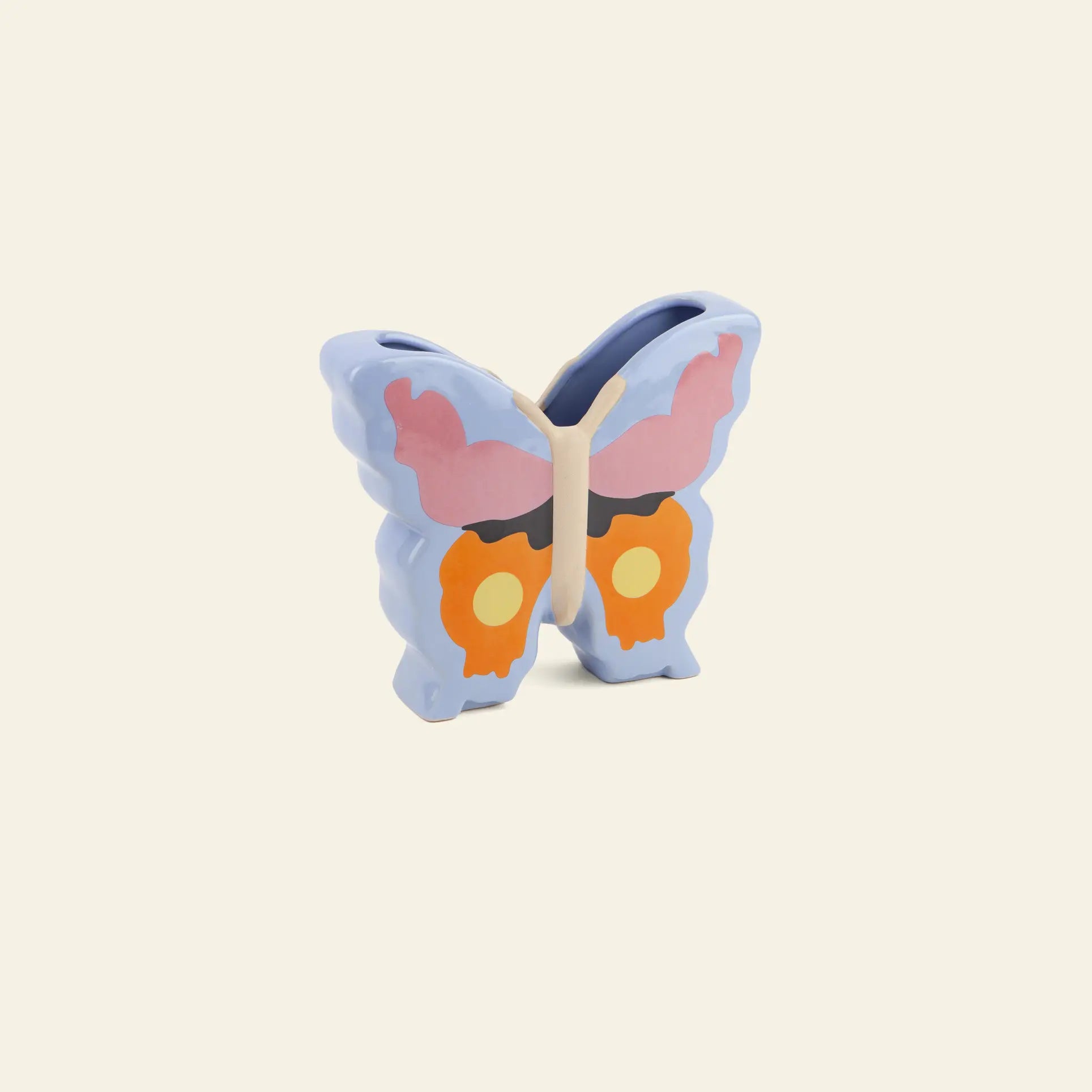 The DOIY Woodland Butterfly Vase by DOIY features a charming butterfly silhouette with pastel blue wings accented by pink and orange—perfect for adding a cottage-inspired touch to any space.