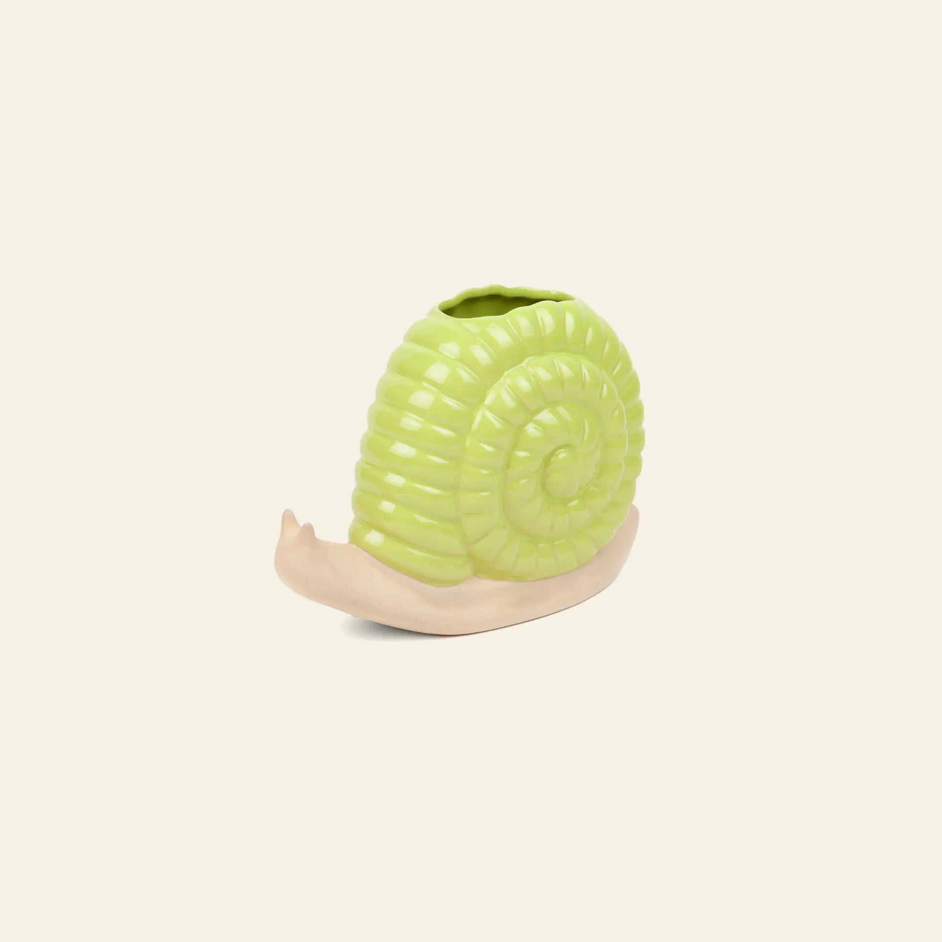 The DOIY Woodland Snail Vase by DOIY features a light beige ceramic body with a glossy green shell, creating a charming decorative accent when placed against a plain cream background.