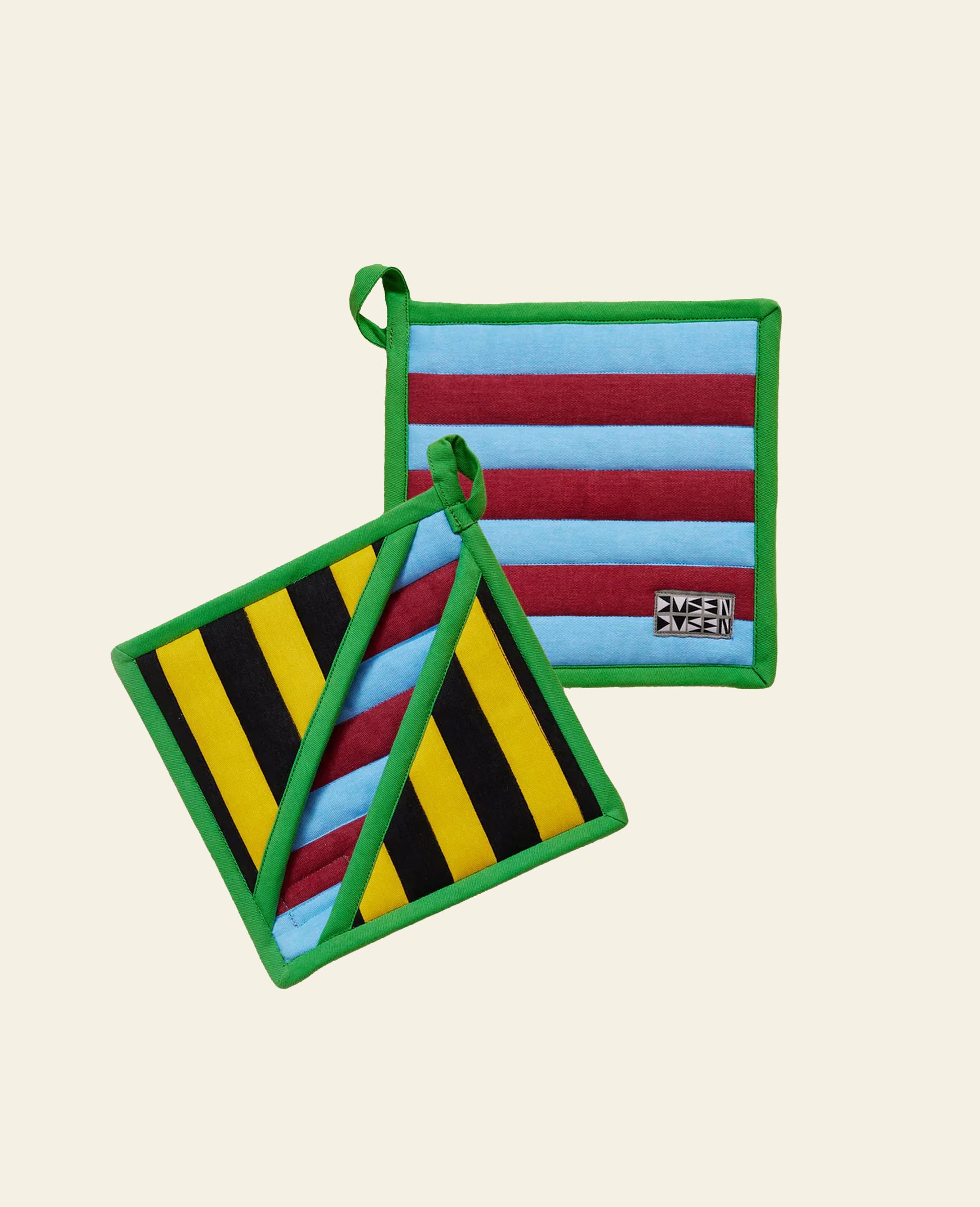 The Dusen Dusen Pocket Pot Holders by Dusen Dusen are colorful, heat-resistant kitchen accessories with green borders, blue/maroon or yellow/black patterns, and fabric loops for easy hanging.