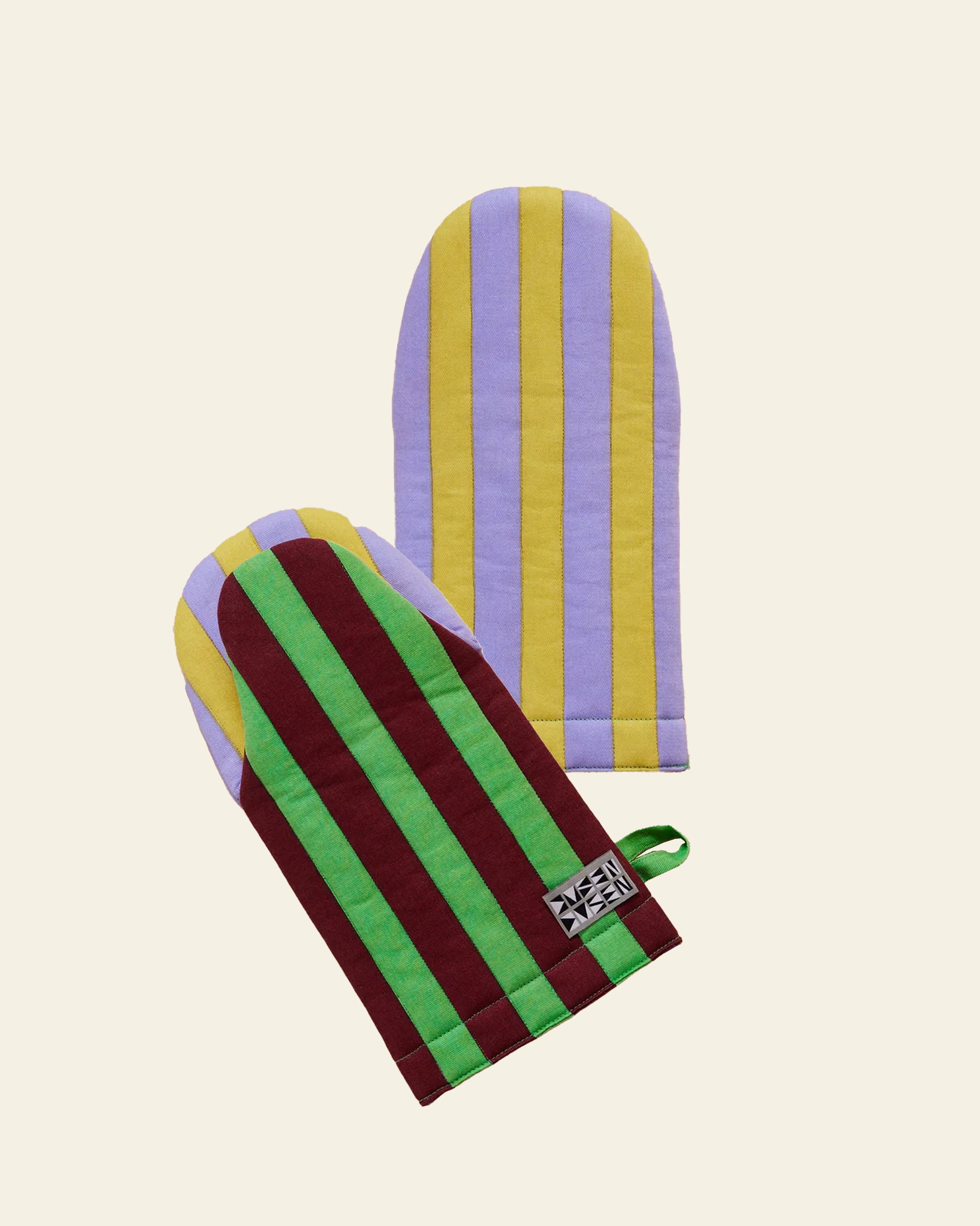 The Dusen Dusen Striped Oven Mitt by Dusen Dusen features vertical yellow and lavender or green and burgundy stripes, a heat-resistant design, small tag, and loop on a plain beige background—perfect for any kitchen.