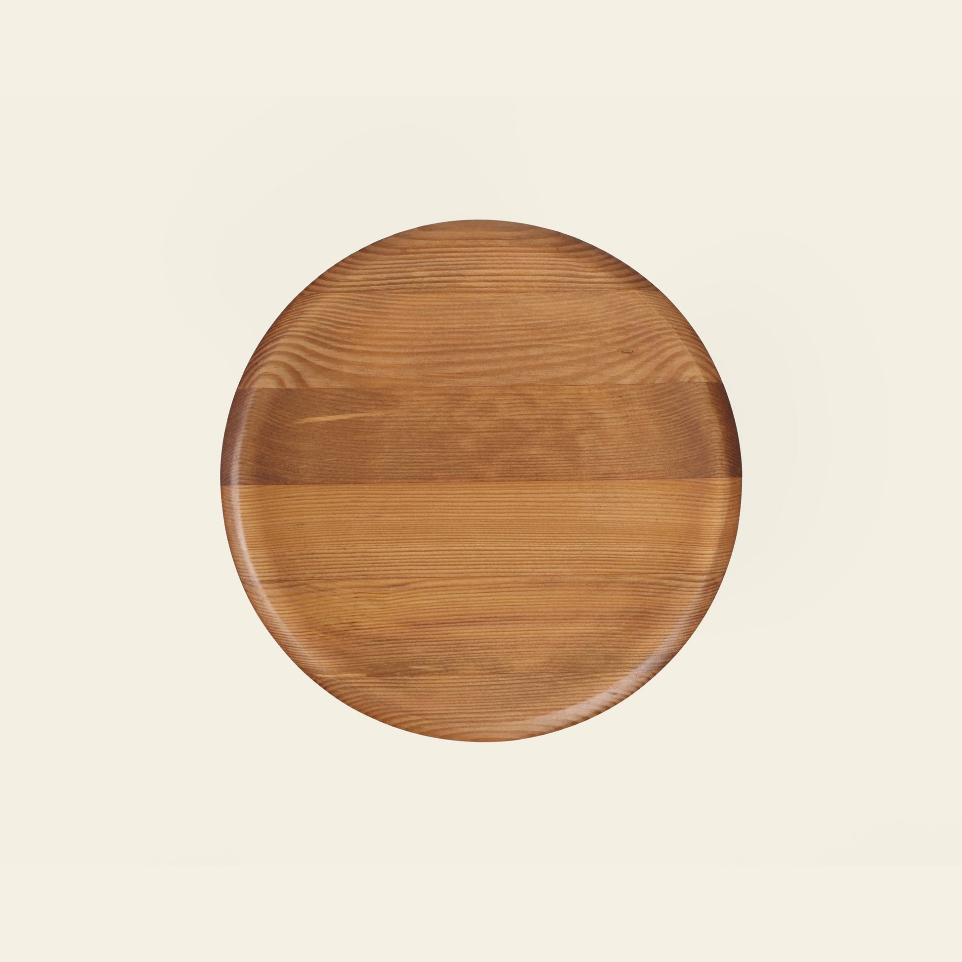 The FRAMA AML Stool by FRAMA, crafted from solid oiled pine with visible wood grain and a smooth finish, is centered on a plain light background.