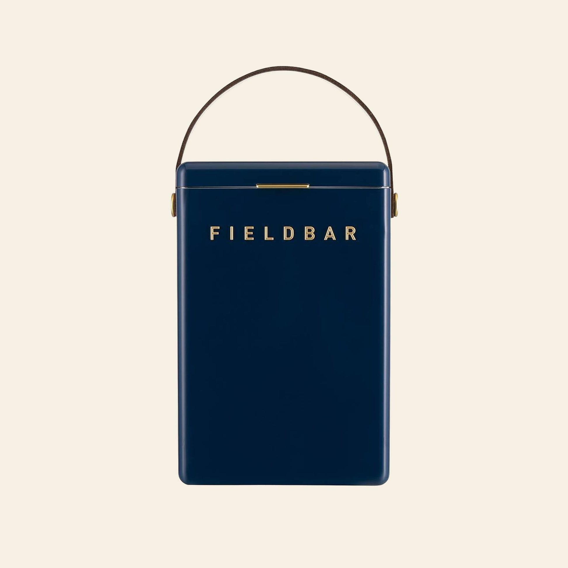 A dark blue rectangular Fieldbar Drinks Box by Fieldbar features a gold clasp, gold FIELD BAR lettering on the front, and a brown handle, celebrated for superior thermal performance, shown against a plain light background.
