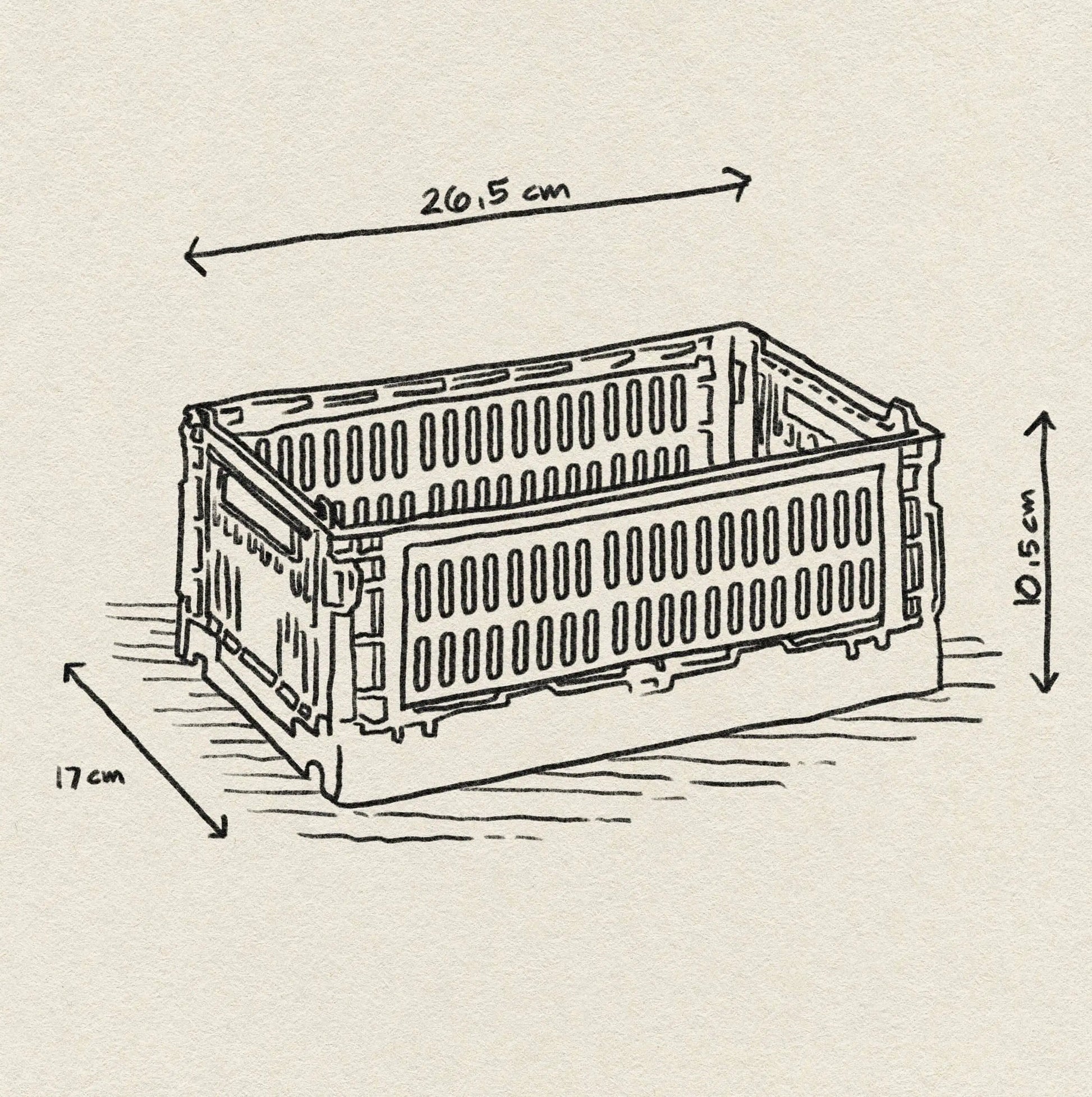 A black and white sketch of the HAY Colour Crate Small by HAY, a rectangular plastic crate with slotted sides, labeled as 26.5 cm x 17 cm x 10.5 cm, resting on a textured surface. Inspired by the HAY Color Crate design.