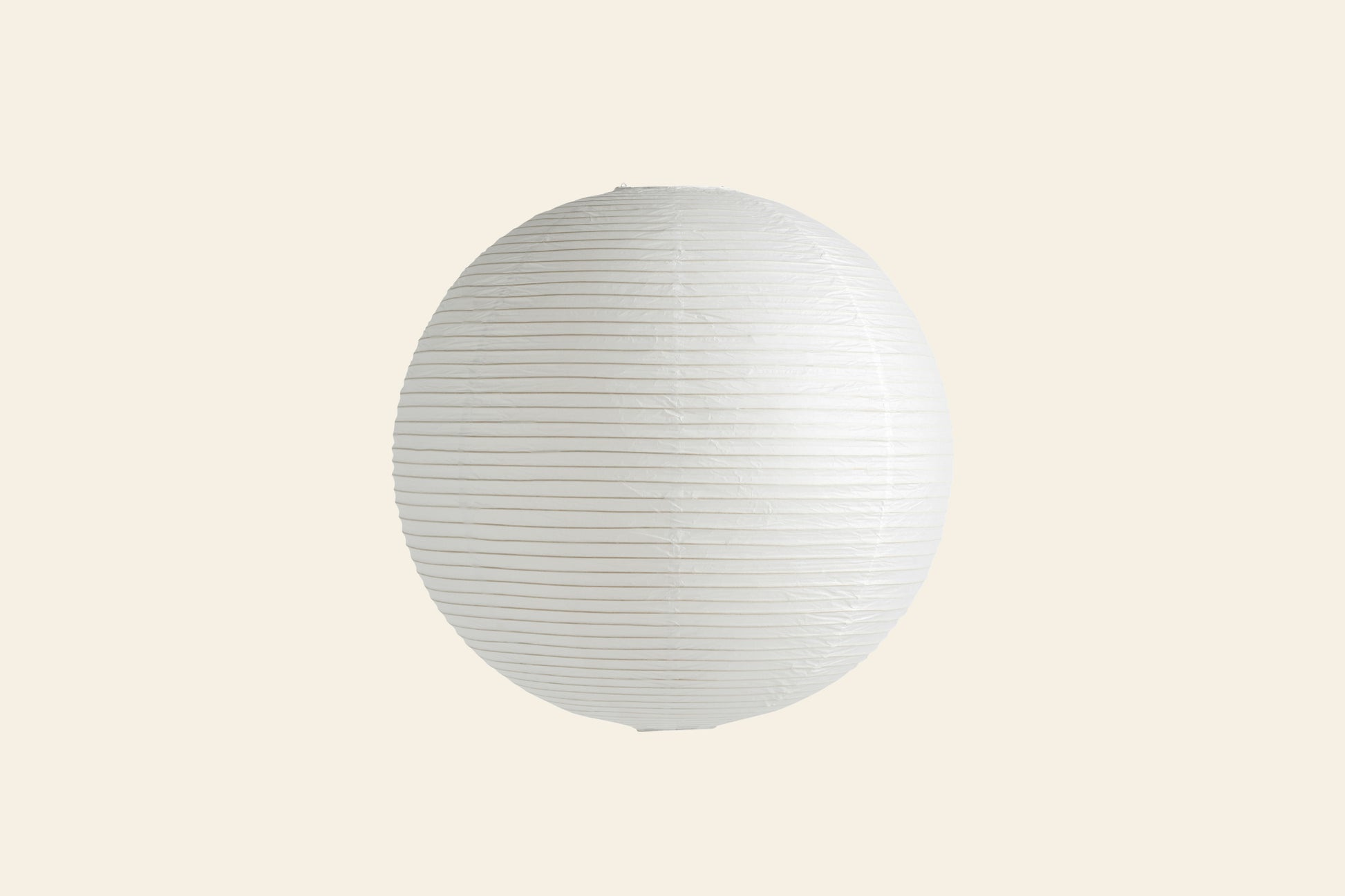 The HAY Paper Shade 60cm Pendant is a round, white lantern-style light with horizontal ribbing and a rice paper shade. Centered on a light beige background, it's LED compatible for modern versatility. Brand: HAY.