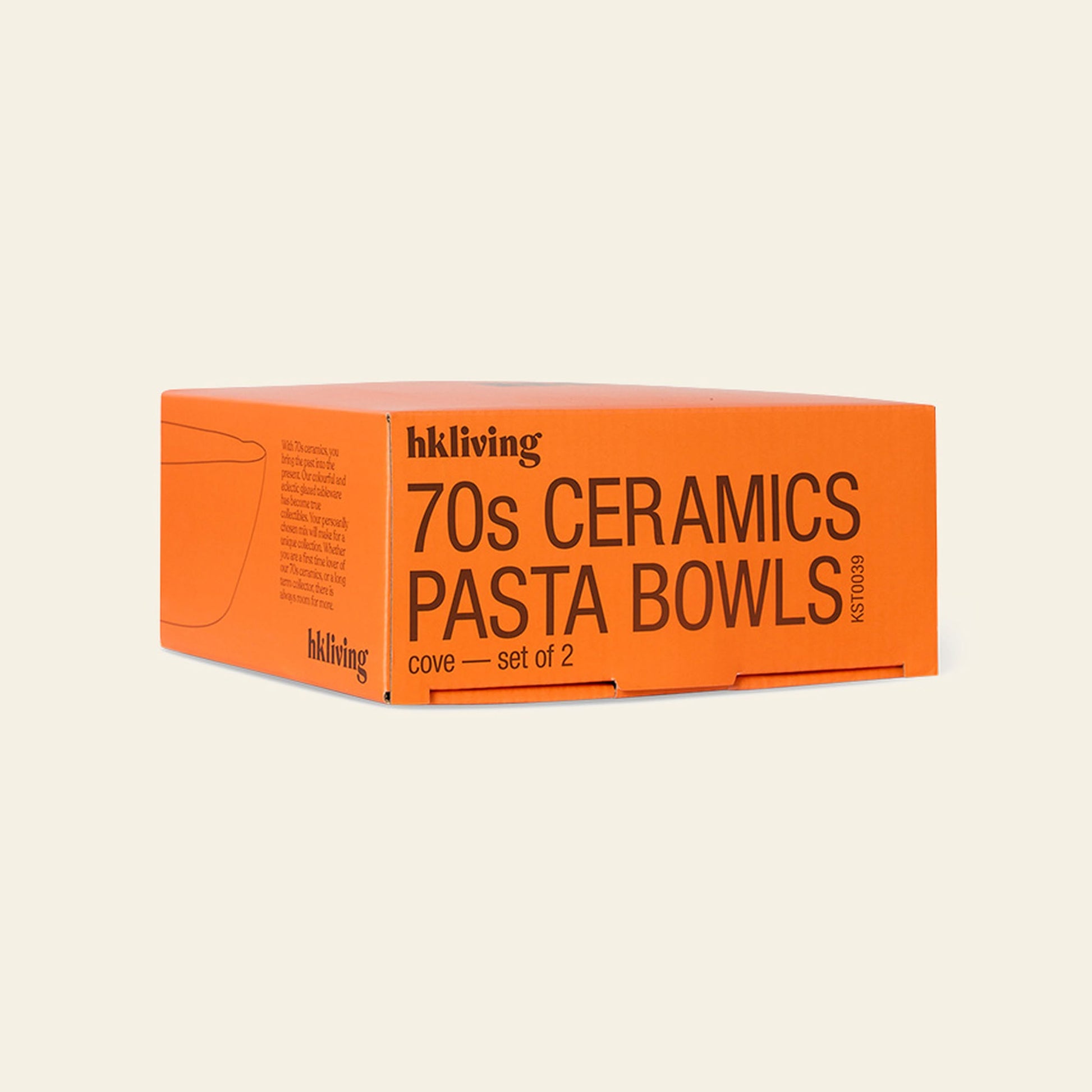 A vibrant orange box labeled HKliving 70s Ceramics: Pasta Bowls, Set of 2 rests on a light surface. The retro packaging from HKliving features minimal line art of a bowl on its side.
