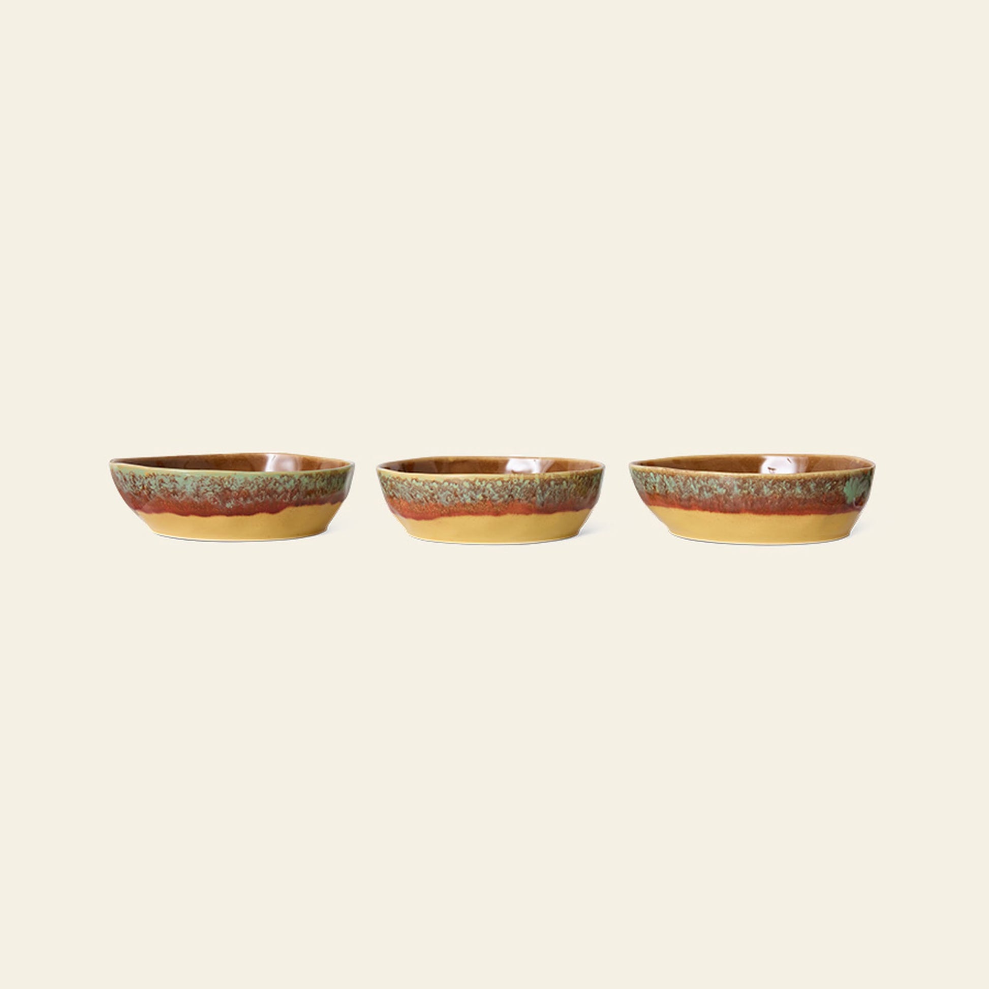 The HKliving 70s Ceramics: Pasta Bowls, Set of 2 features glossy, earth-toned glazes in brown, orange, and green stripes for a retro touch—perfect vintage-inspired tableware to elevate any setting.