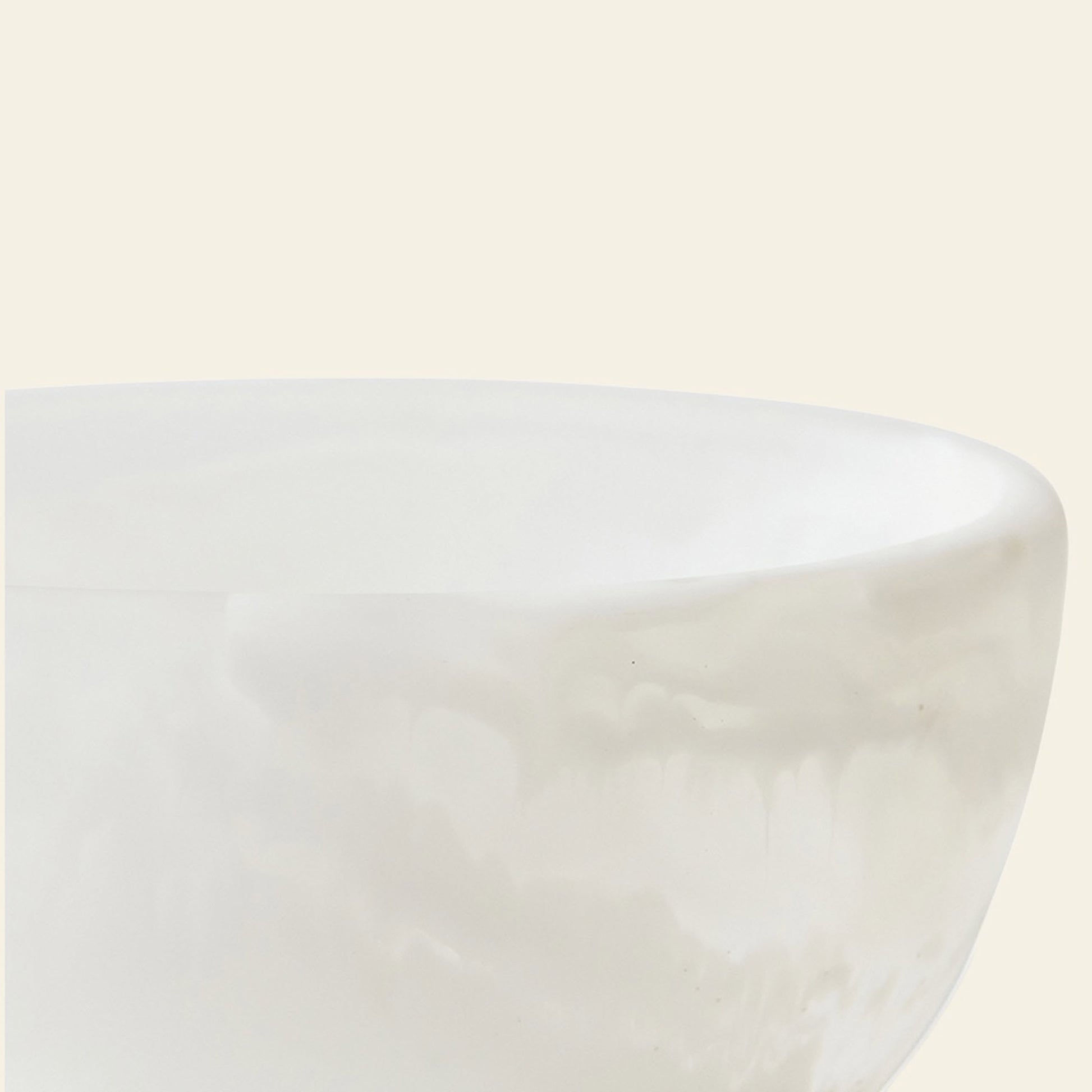 A close-up of the HKLIVING Patio Bowl by HKLIVING, featuring a large, smooth white marbled resin design with subtle veining and a soft matte finish, perfect for outdoor entertaining against a beige background.