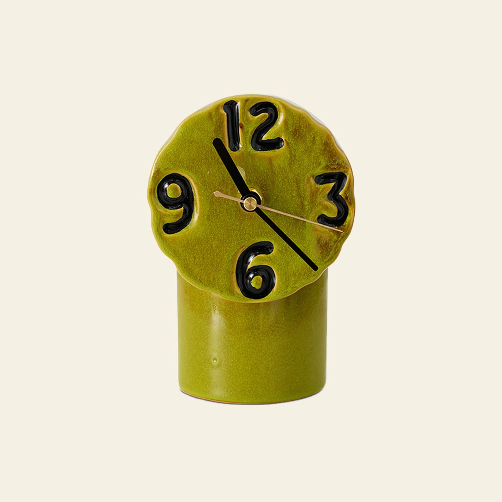 The HKLIVING Retro Ceramic Clock - Olive features a rounded, uneven face with large black numbers and clock hands at 10:10. Its vintage-inspired ceramic design by HKLIVING adds nostalgic charm to any room.