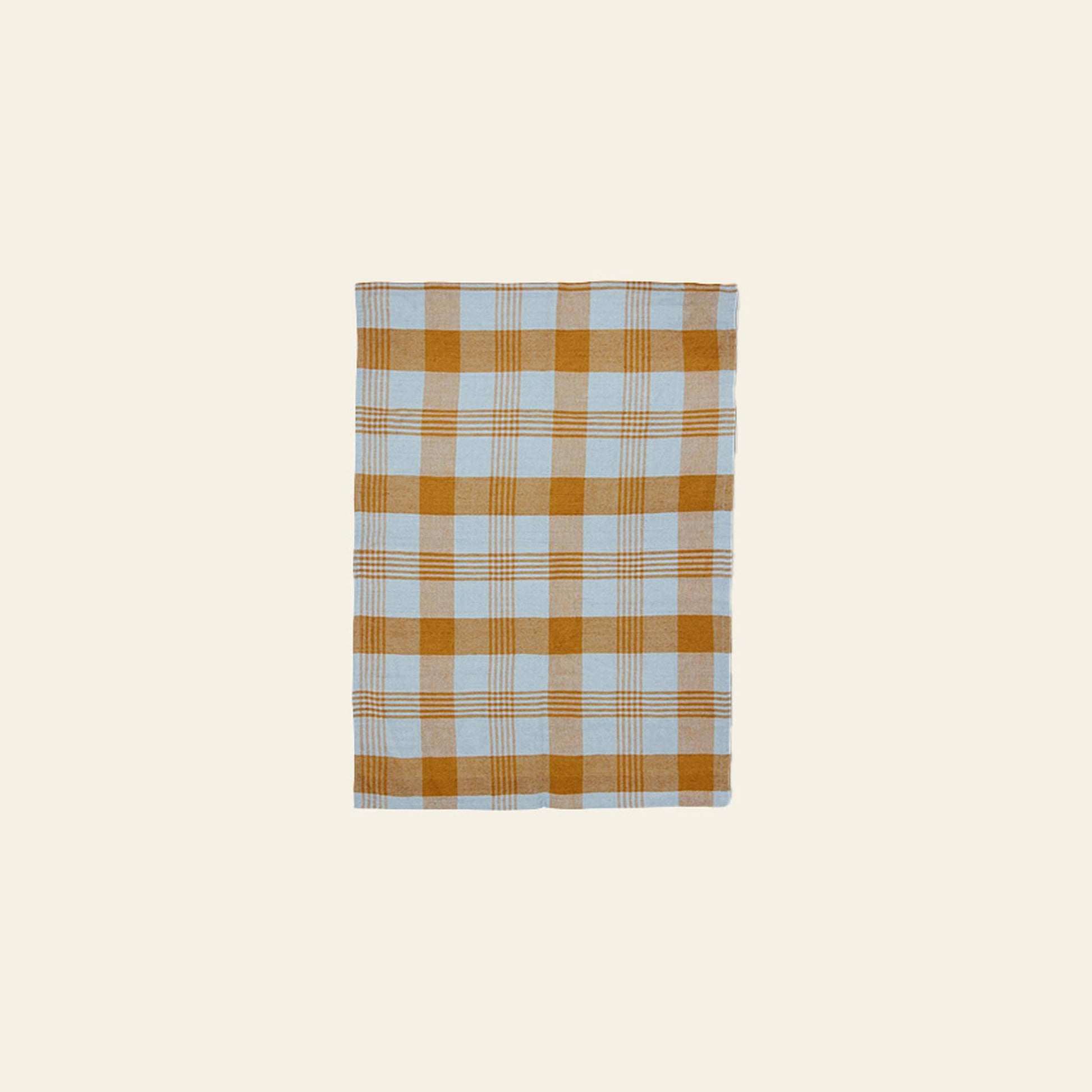 The HKLIVING Vida Check Tea Towel in Amber/Blue features a rectangular linen design with a light blue and mustard yellow checkered pattern on a plain, light beige background.