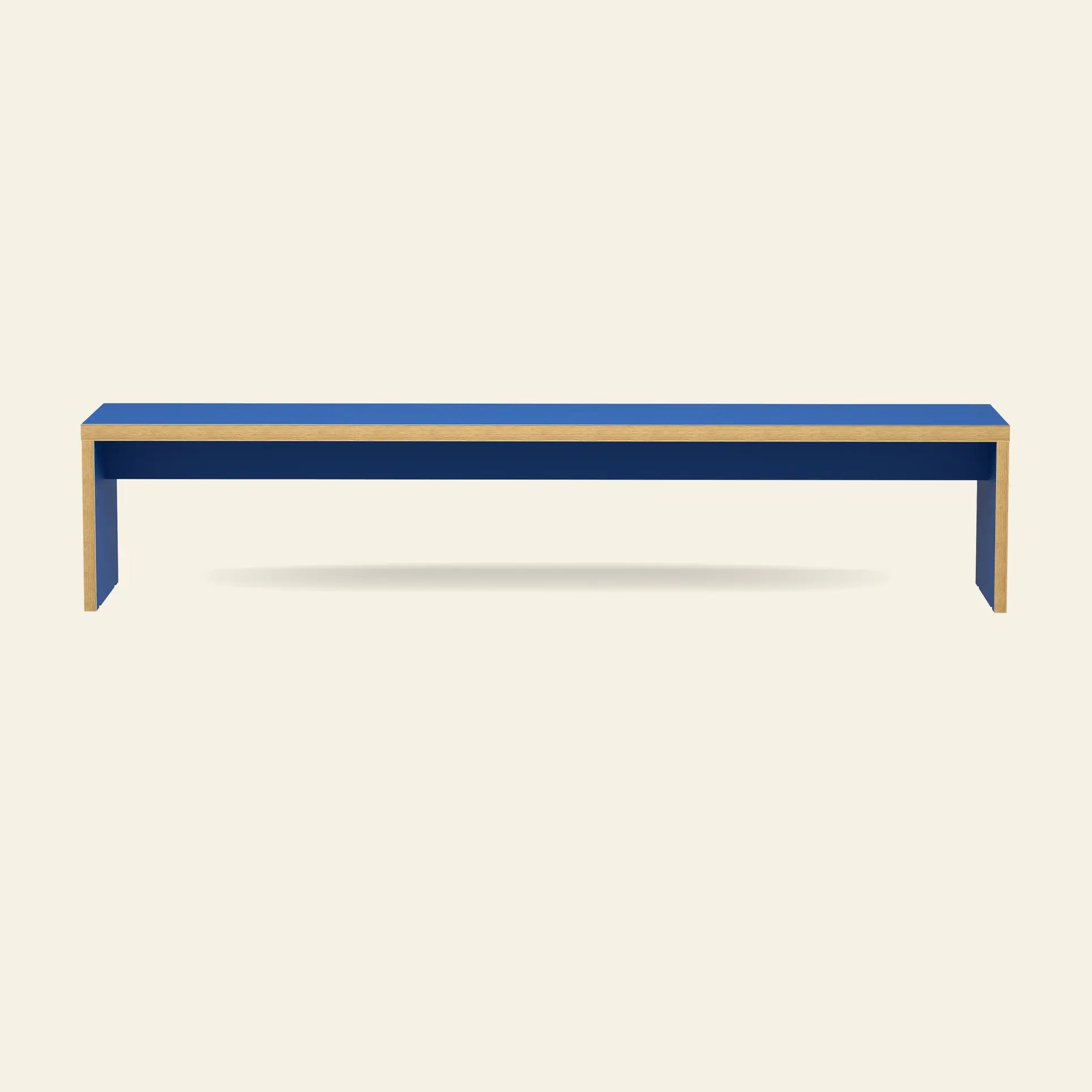 The HKliving Bench, 220cm by HKliving features a long, minimalist rectangular design with blue surfaces and light wood edges—ideal space-saving seating for modern interiors, shown against an off-white background.