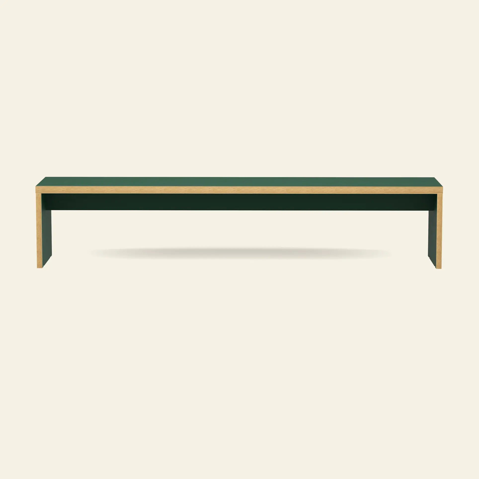 The HKliving Bench, 220cm by HKliving features a minimalist design with a dark green top and light wood edges, ideal for saving space and adding style to your dining table setting. Displayed against a plain beige background.