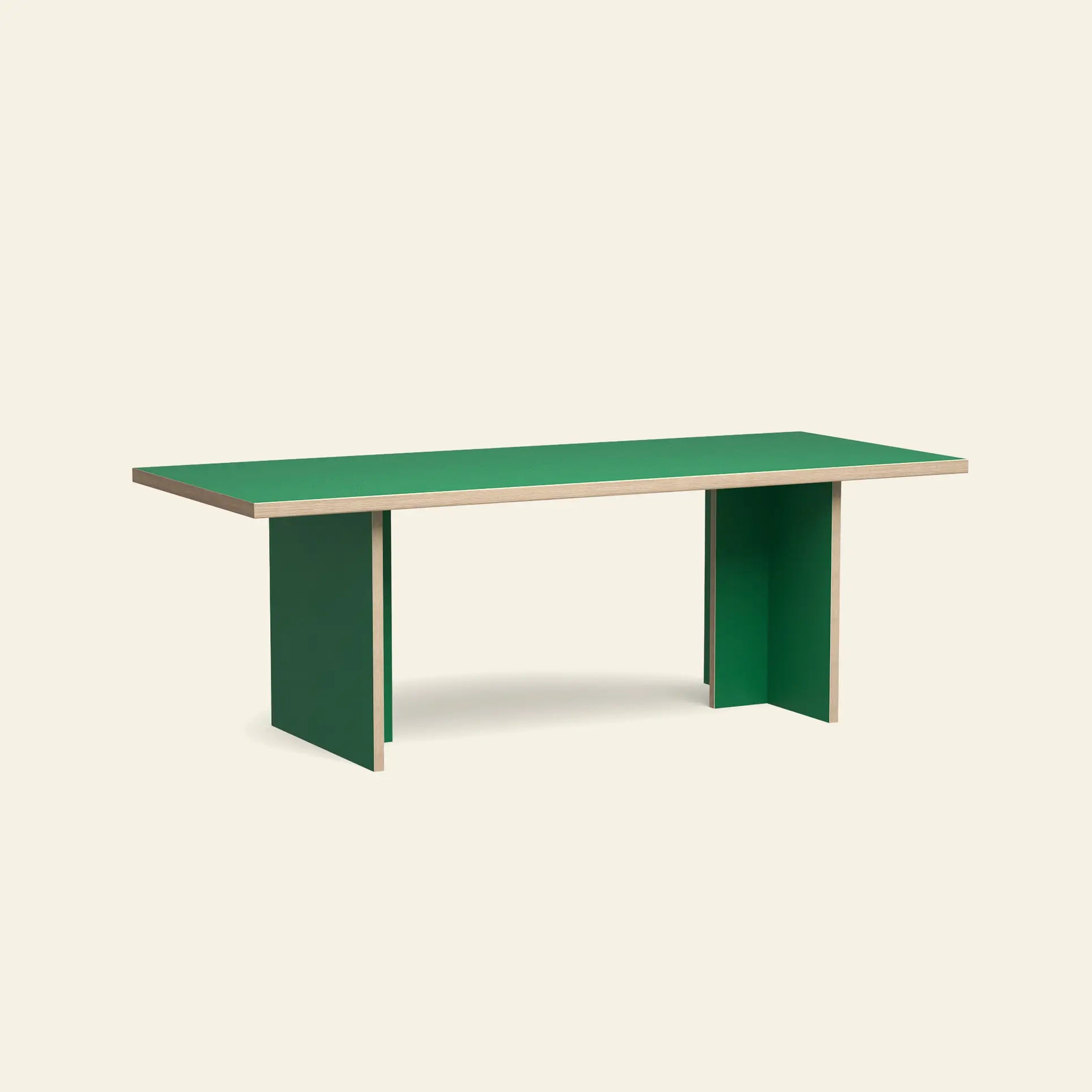 The HKliving Dining Table, Rectangular, 220cm—by HKliving—features a green top and panel legs with visible plywood edges. This stylish, timeless piece is shown on a plain beige background and comes in standard sizes.