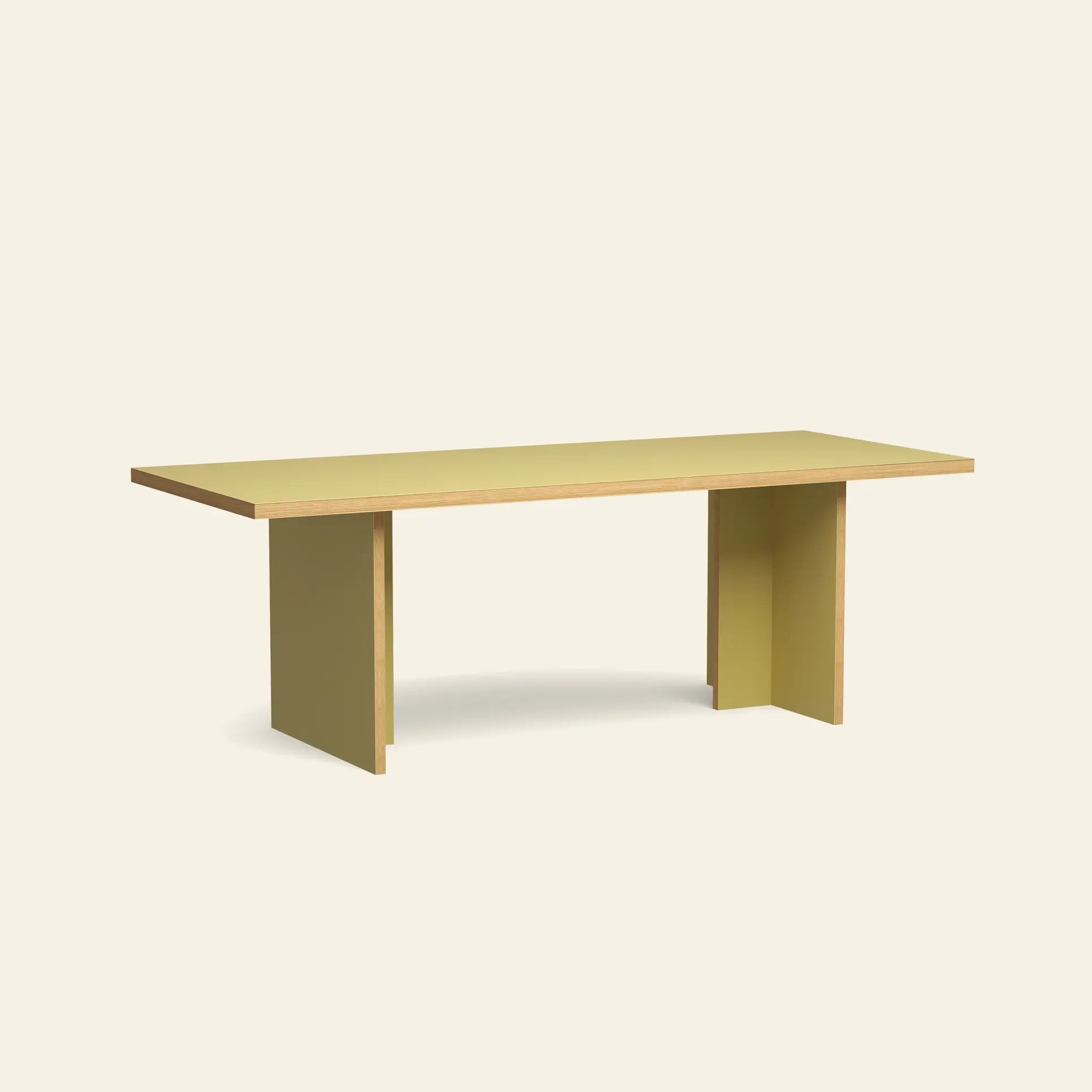 The HKliving Dining Table, Rectangular, 220cm by HKliving features a minimalist design with a flat yellow surface and two wide yellow legs—an elegant piece that complements any space. Available in standard sizes.