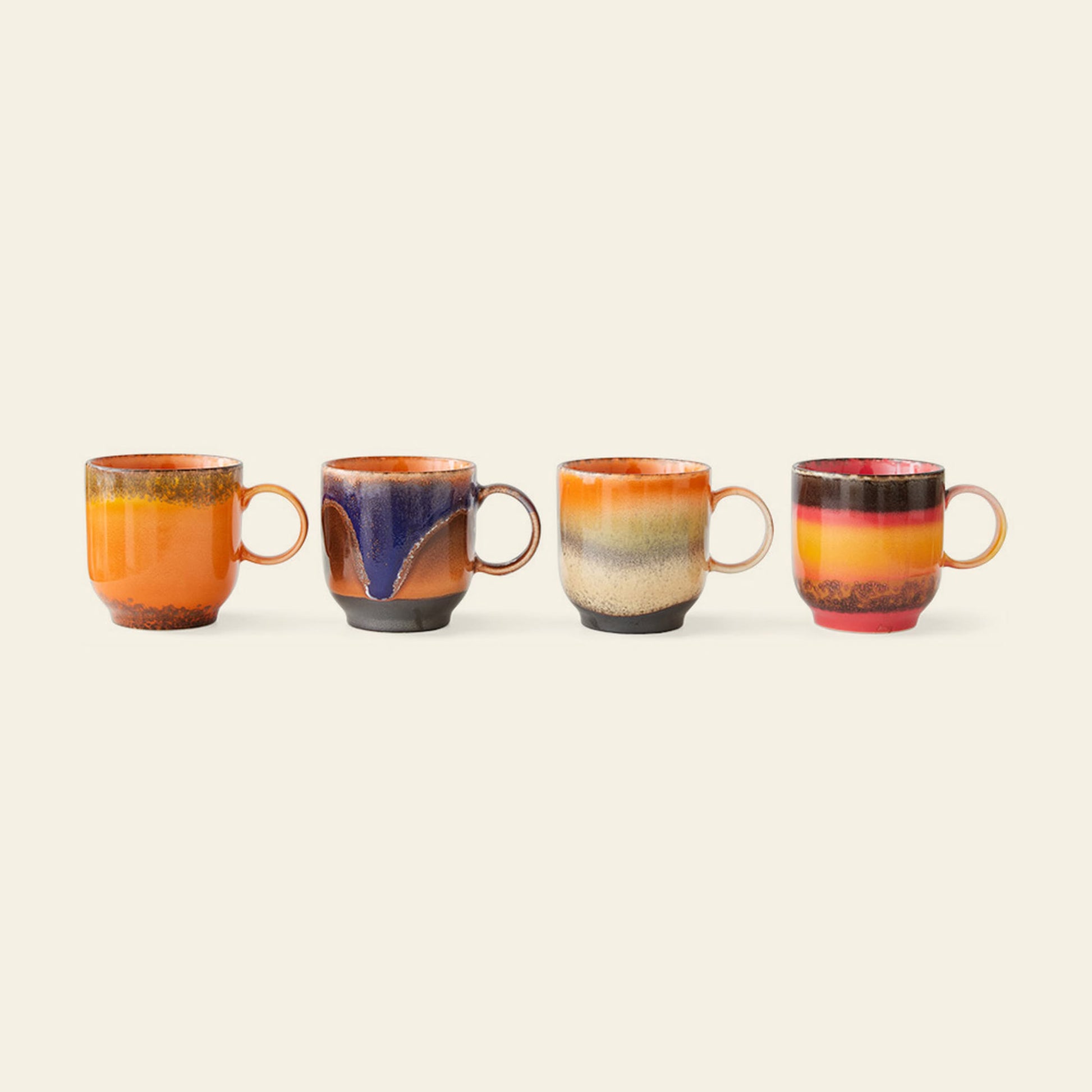 HKliving 70s Ceramics: Café Mugs, Set of 4—four ceramic mugs with handles, each with unique, vibrant glazes in warm orange, red, yellow, black, and blue—add retro charm to your mug collection. Brand: HKliving.