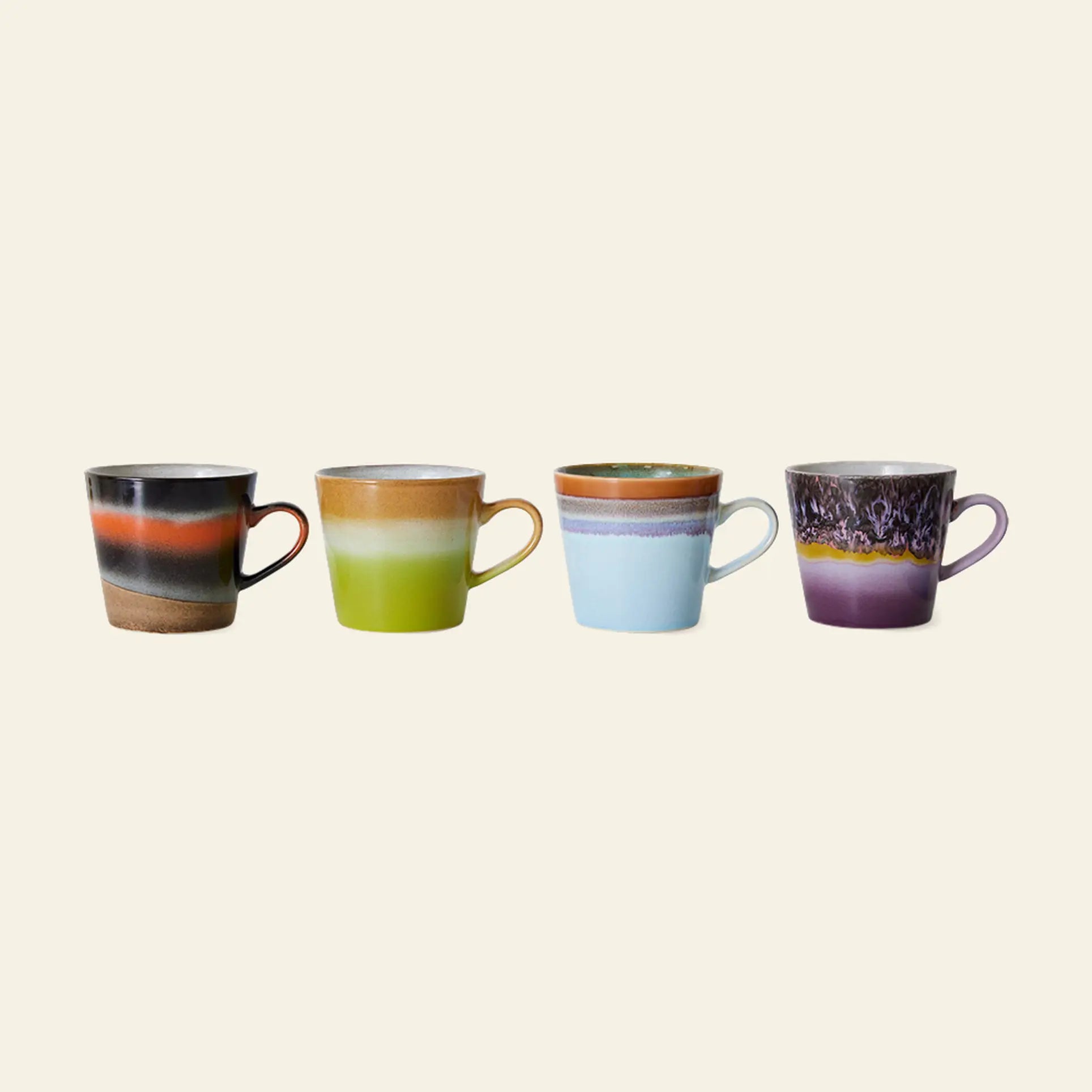The HKliving 70s Ceramics: Cappuccino Mugs, Set of 4, features unique handles and vibrant retro gradients—perfect for adding color and style to your coffee bar.