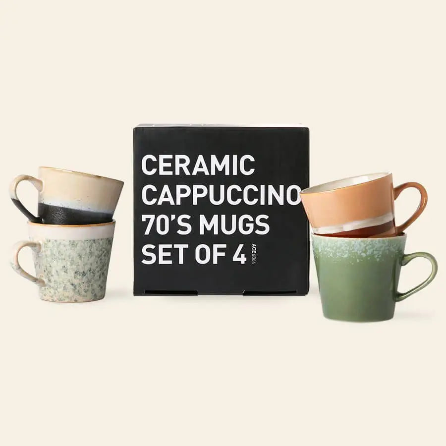 Four HKliving 70s Ceramics: Cappuccino Mugs in assorted colors are arranged around a black box labeled “Set of 4,” ideal for bringing retro style to your coffee bar.