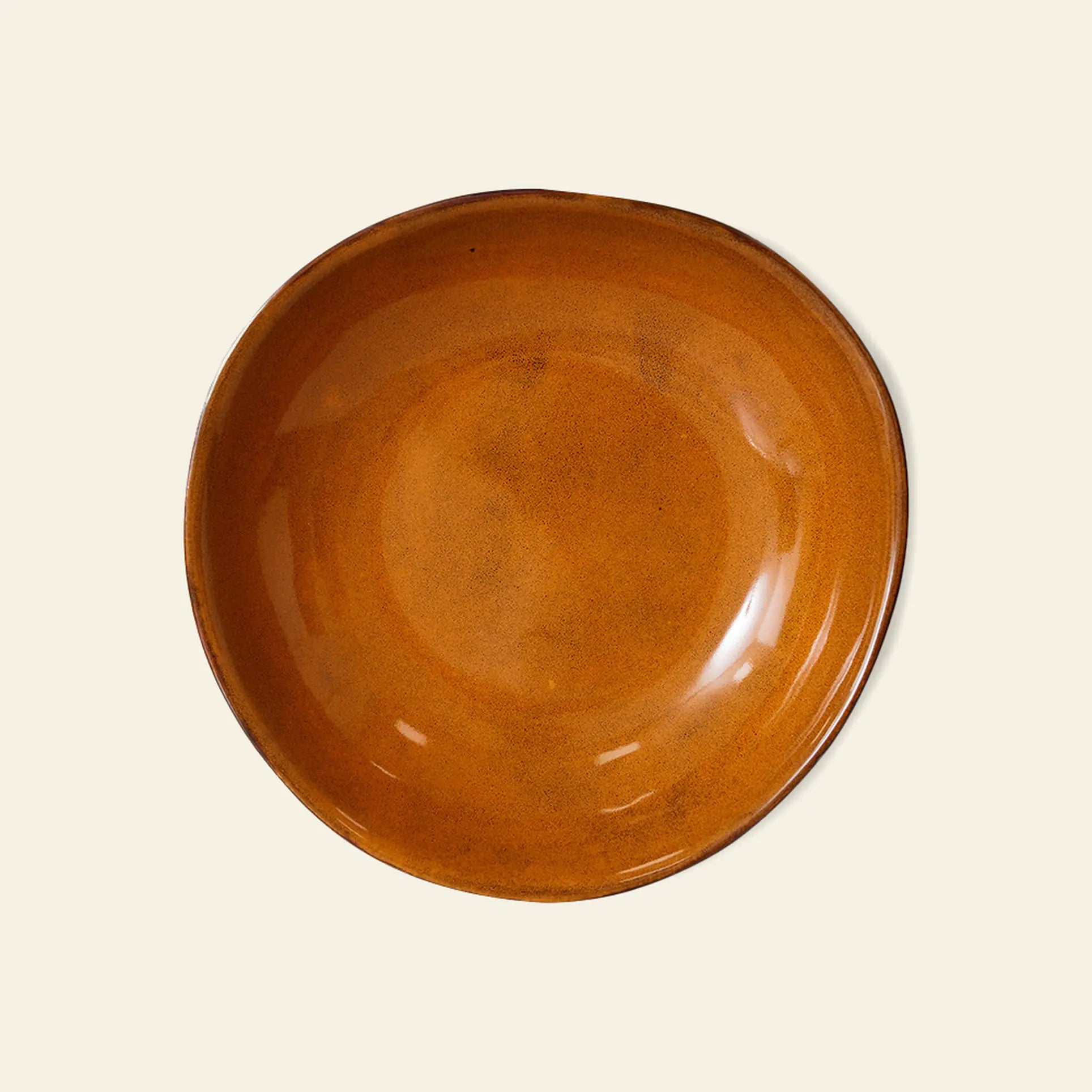 The HKliving 70s Ceramics: Curry Bowls, Set of 2 features round, shallow bowls with a glossy burnt orange glaze and uneven edges, bringing a subtle vintage flair from HKliving to your table.
