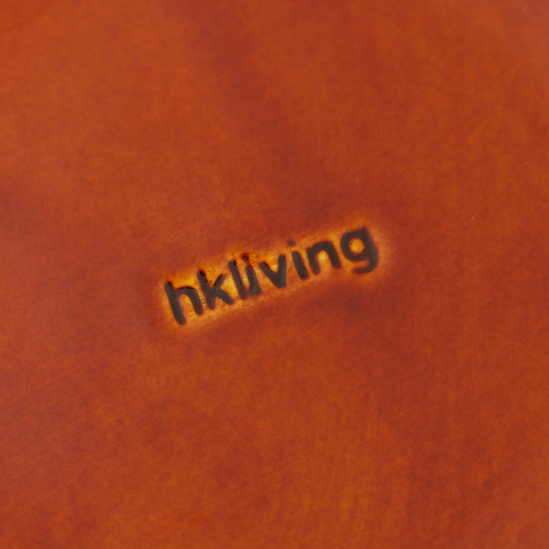 A close-up of HKliving’s 70s Ceramics Curry Bowls (set of 2) highlights the brand name, evoking a vintage feel through the warm brown finish and subtle logo impression.