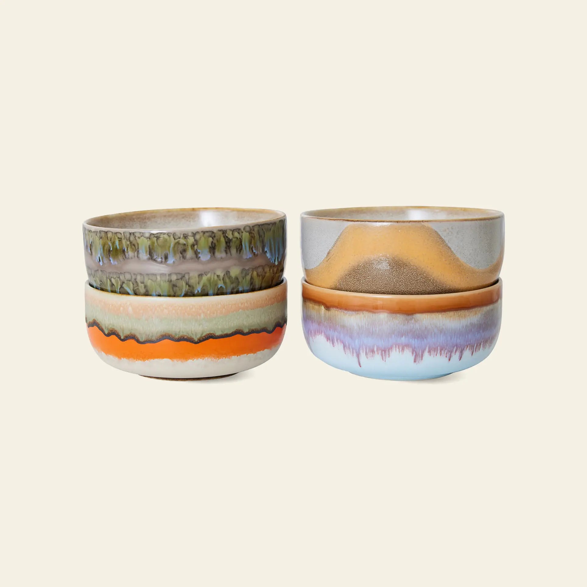 The HKliving 70s Ceramics Dessert Bowls Set of 4 features unique, retro-inspired designs and colorful glazes in earthy and vibrant tones, each bowl showcasing a distinctive pattern reminiscent of vintage ceramics.