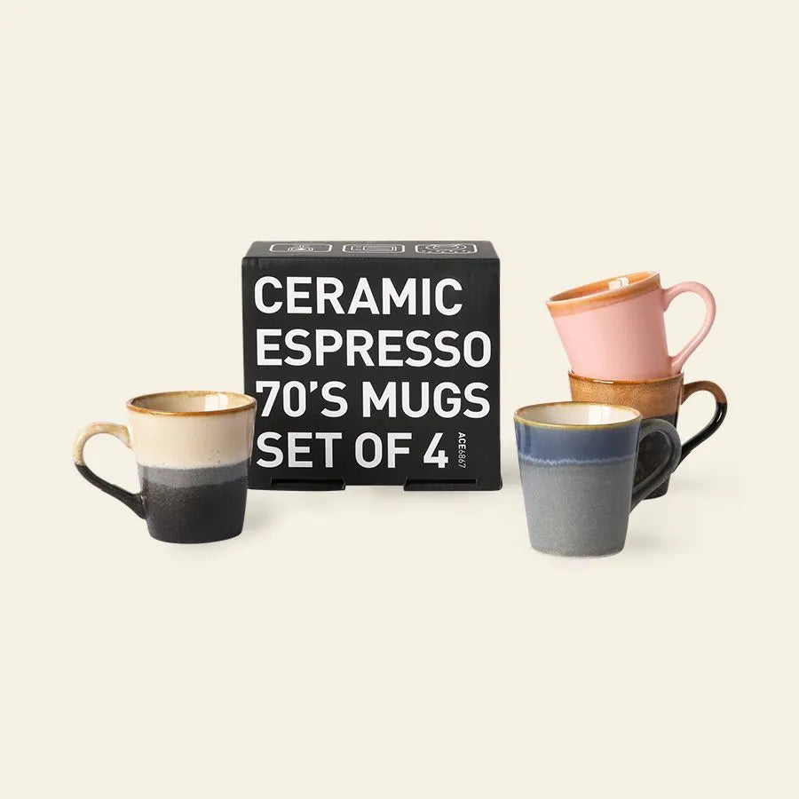 Four colorful HKliving 70s Ceramics espresso mugs (80ml each) are displayed around a black box labeled Espresso Mugs, Set of 4 by HKliving on a light beige background.