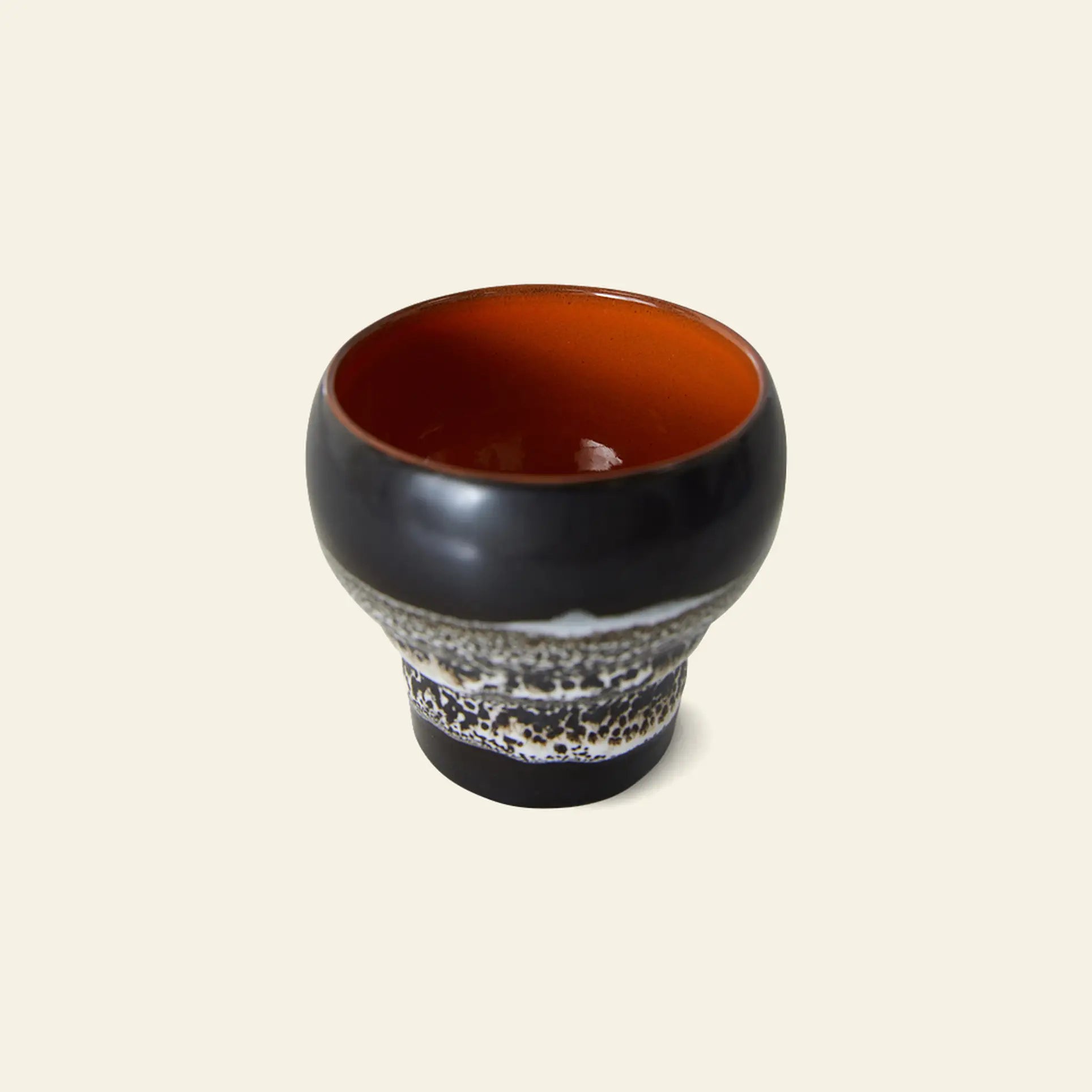 The HKLIVING 70s Ceramics: Lungo Mugs, Set of 2 feature a glossy black exterior, a white and black speckled band, and a deep reddish-brown interior—ideal for coffee lovers. Shown on a plain light background.
