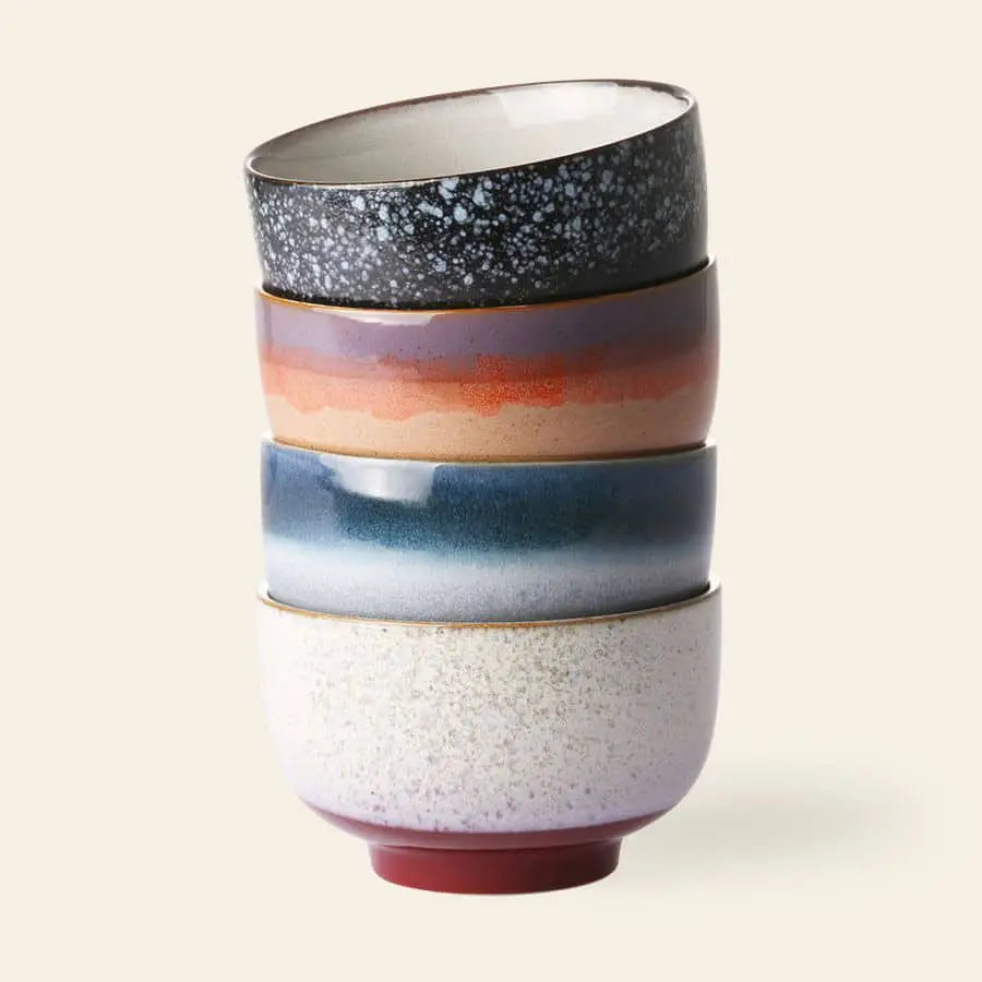 The HKliving 70s Ceramics: Noodle Bowls, Set of 4 features four uniquely colored and patterned bowls by HKliving—speckled black, reddish ombre, blue gradient, and off-white—ideal for serving your favorite dishes.